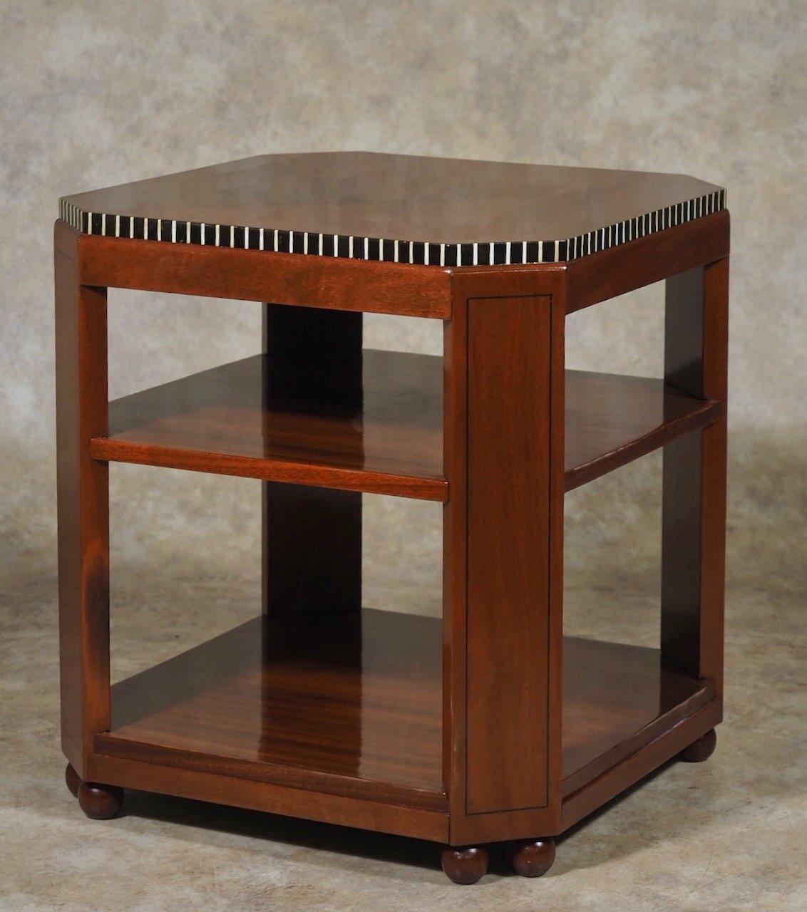 French Modernist Art Deco three-tiered side/end/drinks table by Paul Follot, circa 1926, in mahogany and ebony, with vertical inlays. 20” square x 22” high.

PAUL FOLLOT
(1877 - 1958)


Paris-born decorative artist and sculptor PAUL FOLLOT