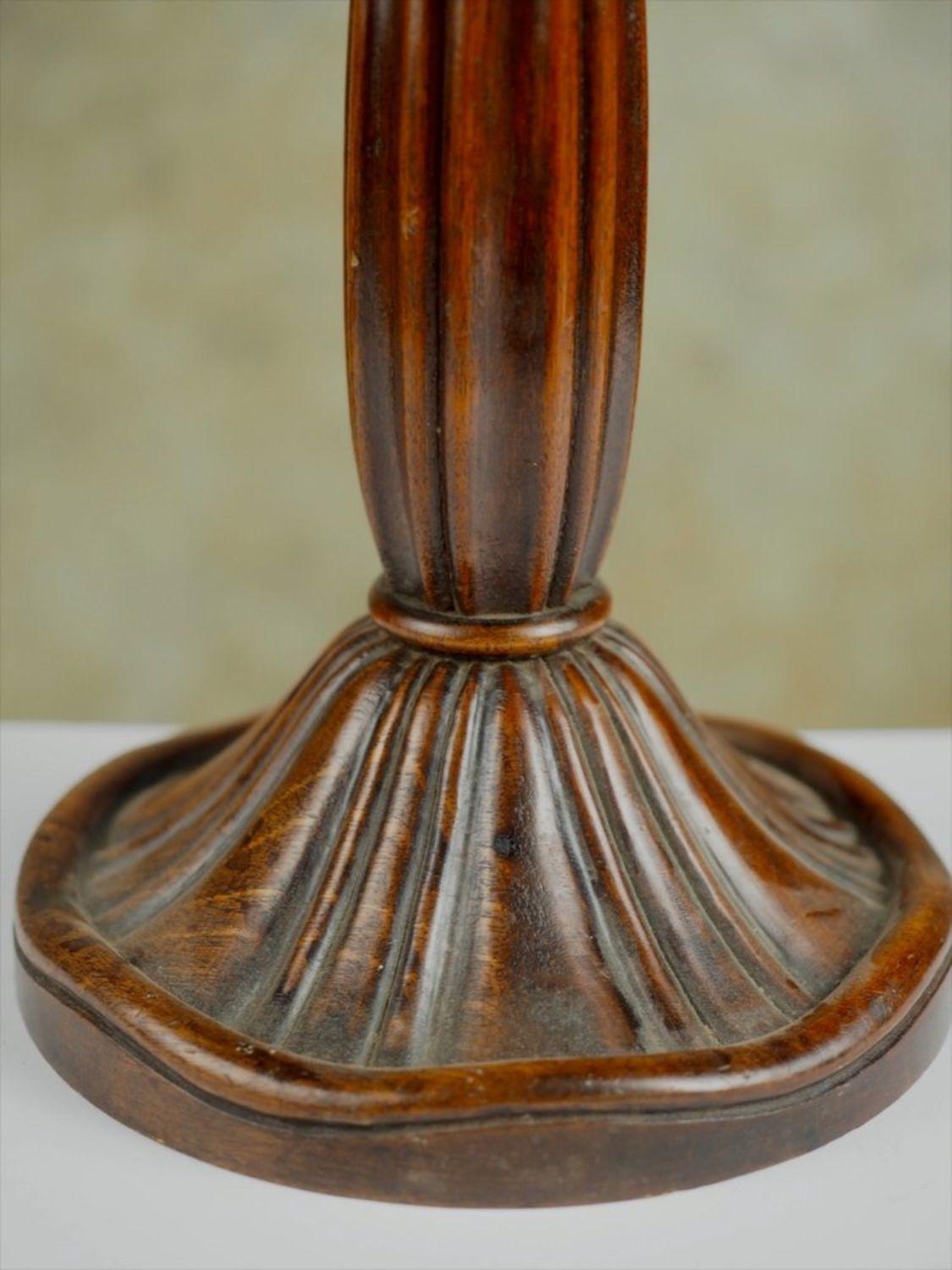 Classic French Art Deco table lamp in sculpted wood, by Paul Follot, circa 1925. 18” high.