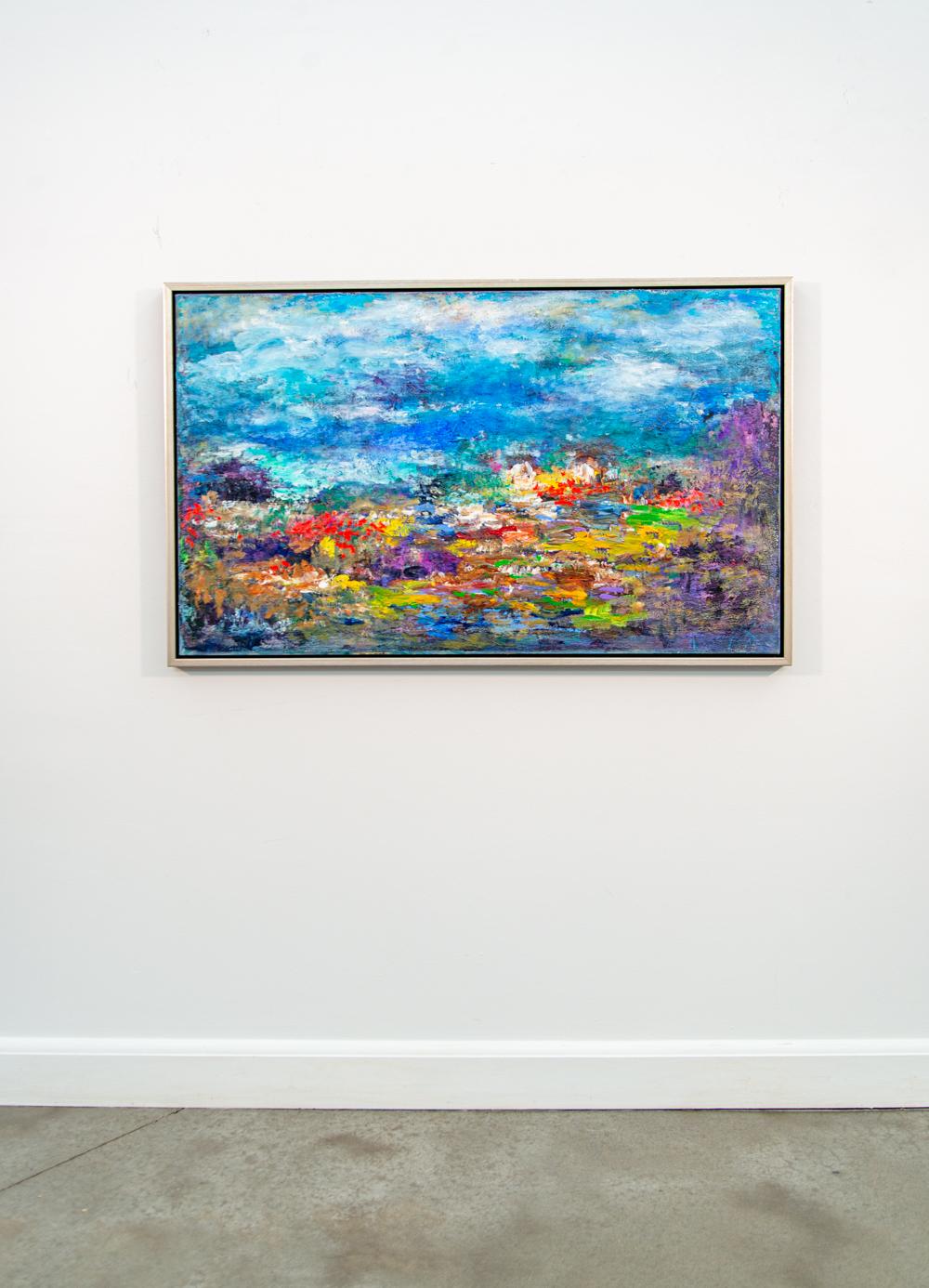 Sous un ciel nuageux d'un bleu profond, les couleurs vives de ce qui semble être un paysage tropical - rouge, jaune, violet et vert - jaillissent de la toile dans cette magnifique composition de Paul Fournier. Considéré comme l'un des