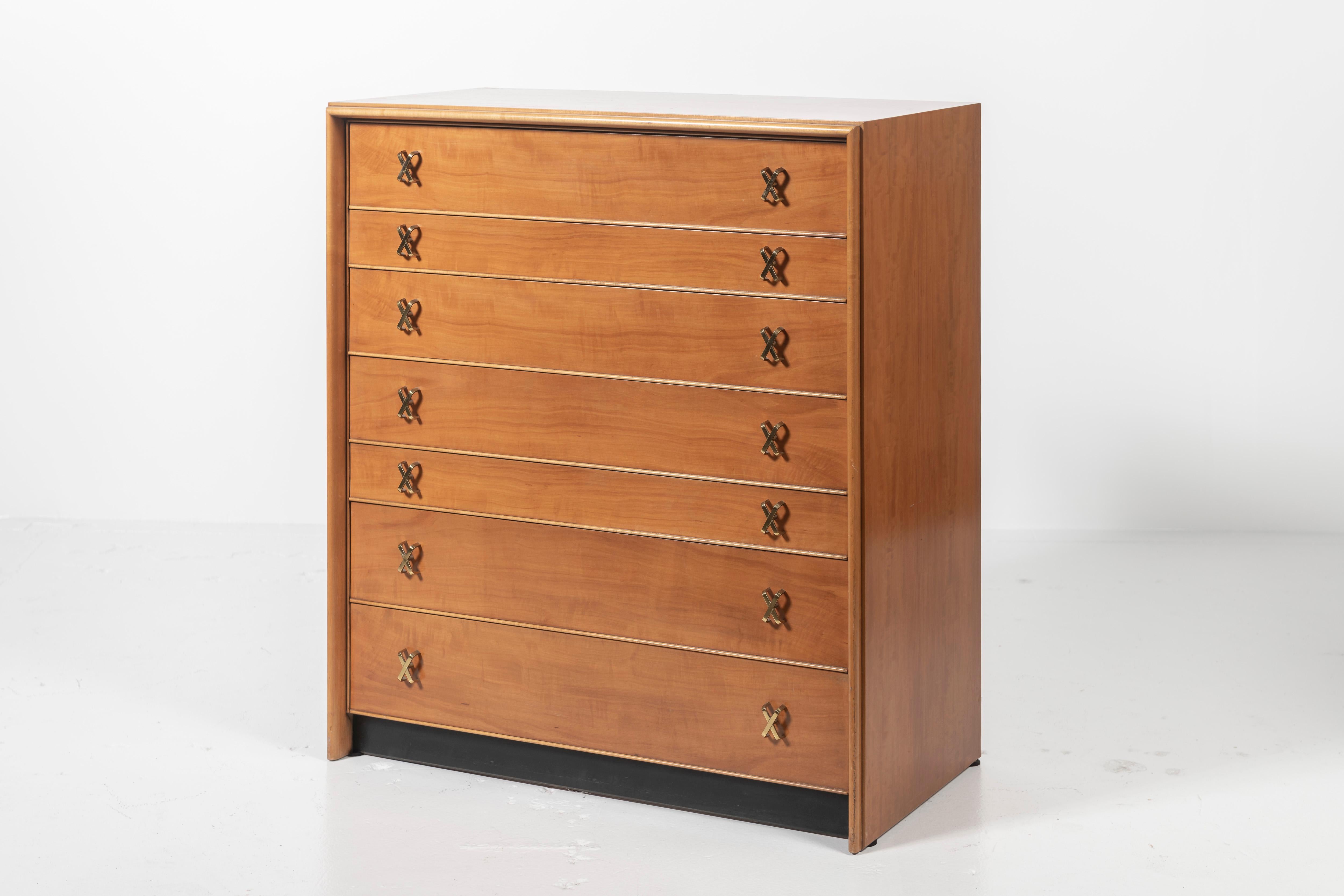 An elegant high chest from Paul Frankl’s Debonaire series for Johnson Furniture Co., the chest features seven drawers with signature X-shaped pulls in brass-plated aluminum. Constructed of pearwood and oak, this piece is in overall good vintage
