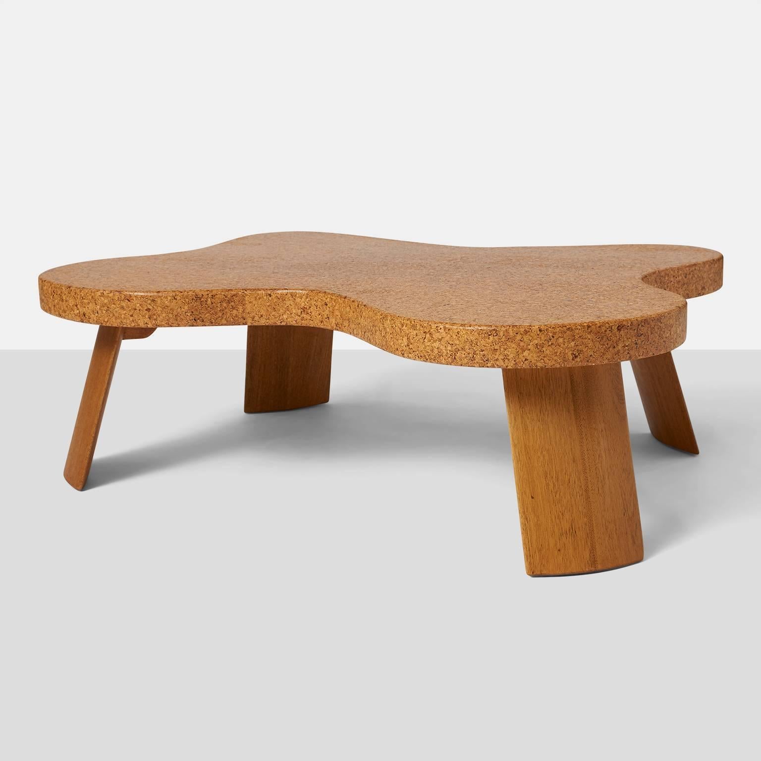 A completely restored Amoeba shaped coffee table with cork top and bleached mahogany legs in flawless condition. Made for Johnson Industries,
USA, circa 1940s.