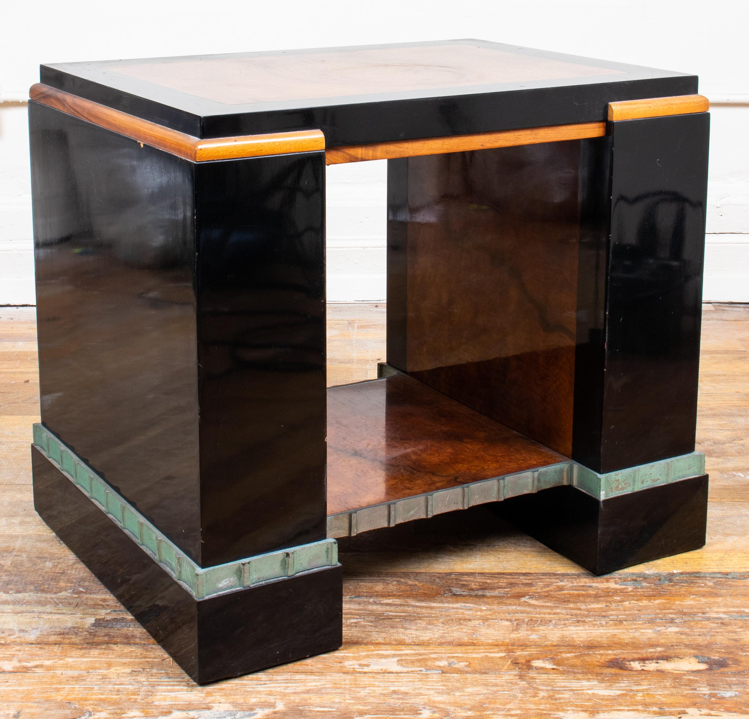 Paul Frankl Art Deco Skyscraper occasional table, circa 1928, commissioned for the Metropolitan Life North Building in New York City, the top inset with walnut veneers within ebonized borders above the lower section with undulating steel band.