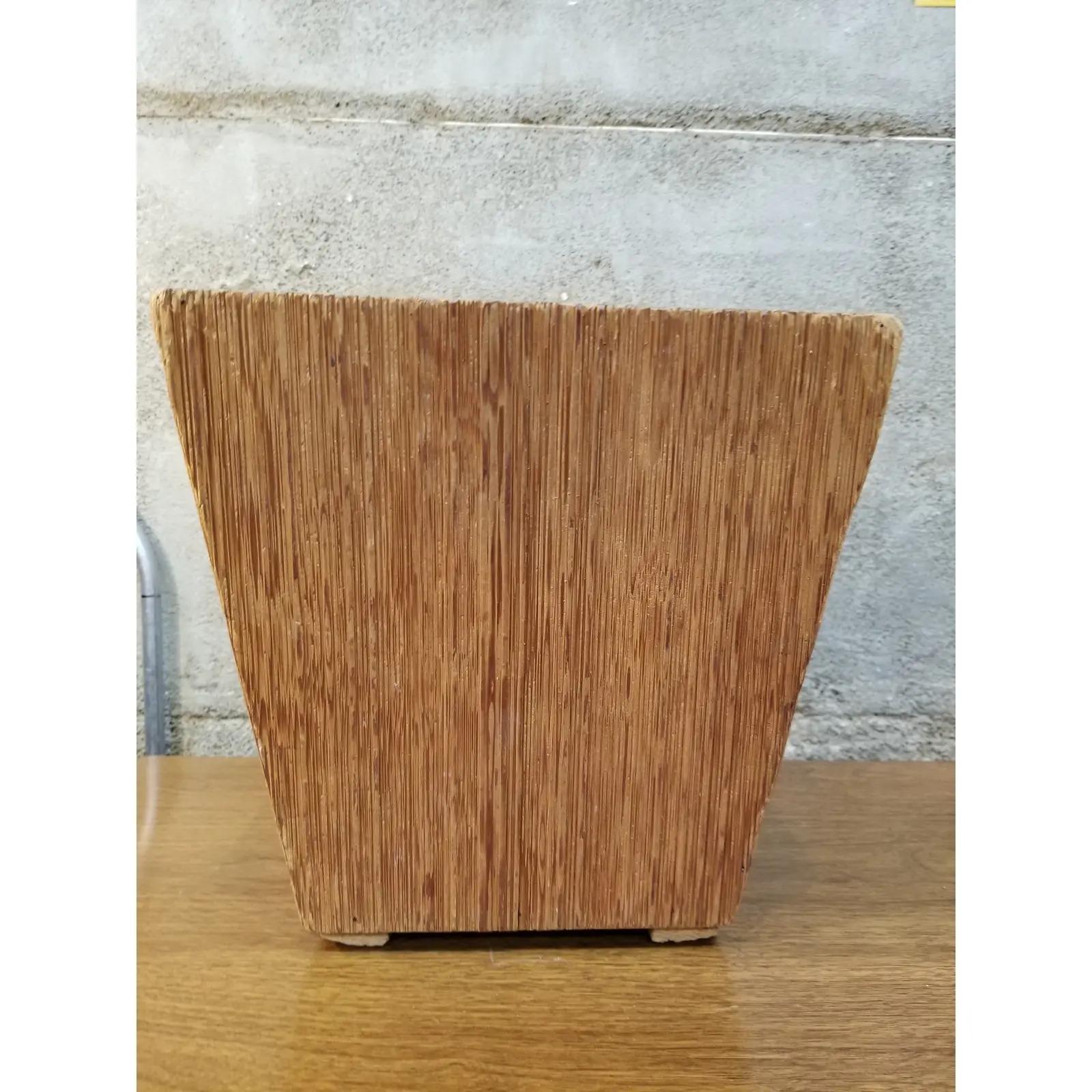 A Mid-Century Modern waste basket attributed to Paul Frankl. Made of combed fir with a conical four sided rectangular design. This item was acquired from a private estate in California, the entire home was filled with documented Paul Frankl