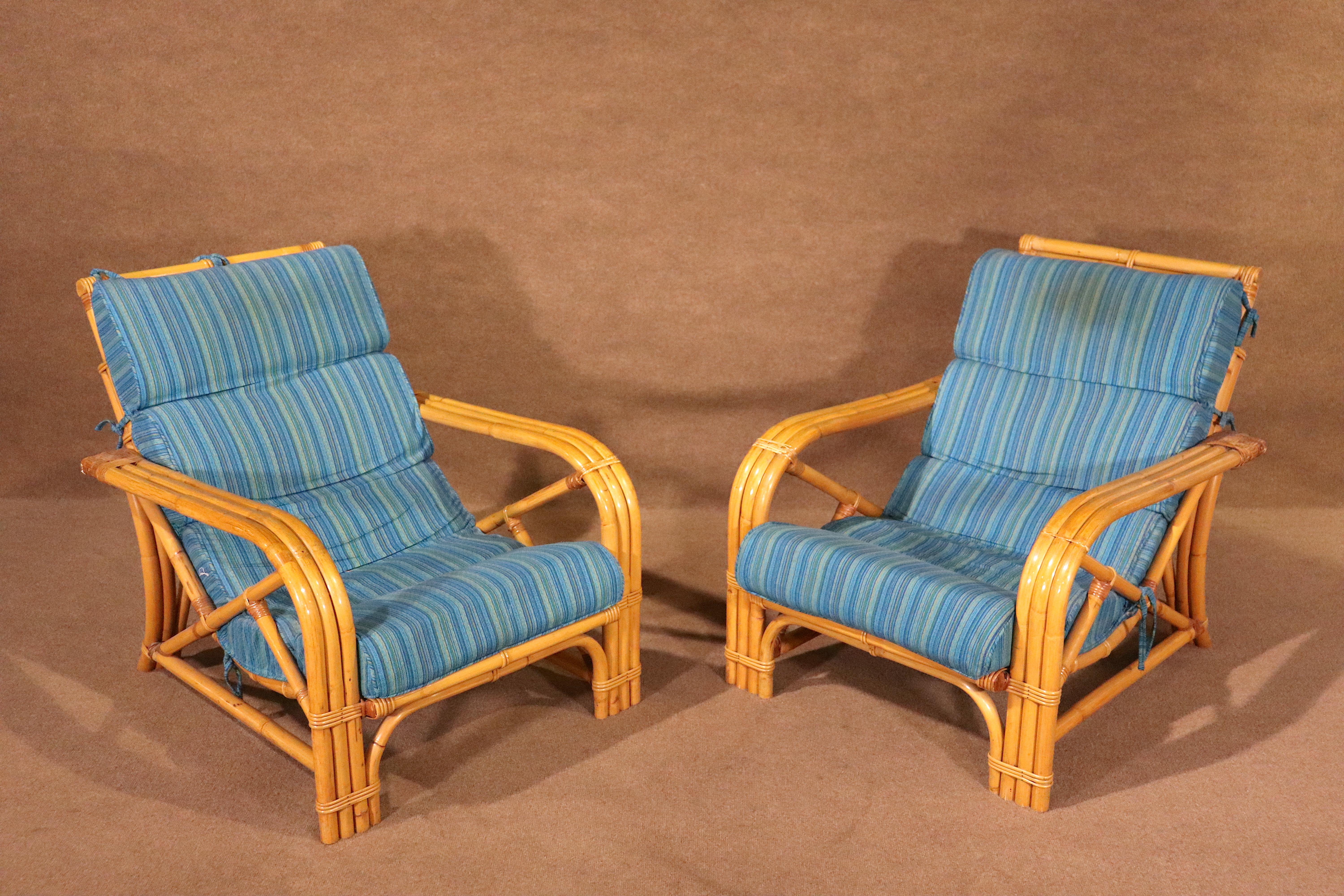 Stylish pair of Mid-Century bamboo chairs, boasting stylish and sturdy bamboo and rattan construction. Unique vintage design, padded seat, and gorgeous complementary colors.

Please confirm pickup location, NY or NJ.