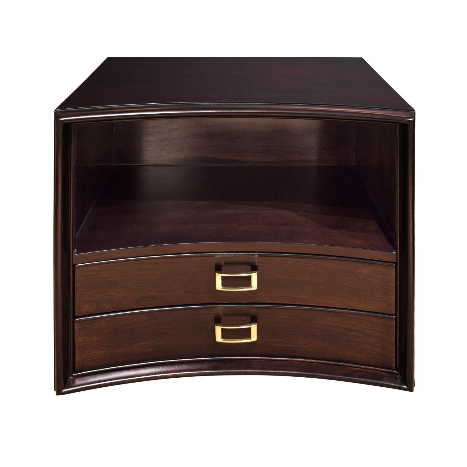 Pair of bedside tables in dark walnut with gently curved fronts, 2 drawers, and brass buckle pulls by Paul Frankl for Johnson Furniture, American 1950's (signed). These have been newly refinished and the pulls have been cleaned and polished. A