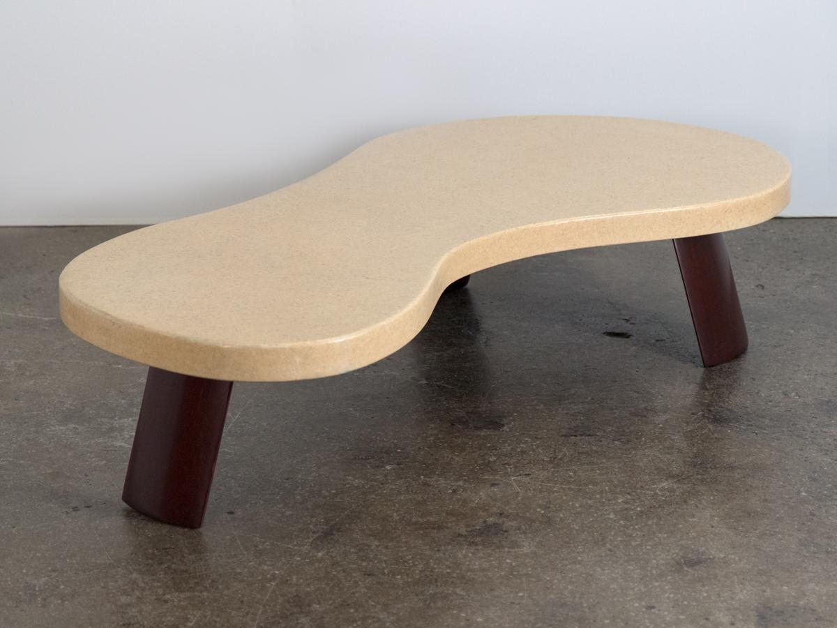 Nicknamed big foot for its playful shape, this biomorphic coffee table is one of Paul Frankl's most important and iconic works. This piece integrates organic form, novel materials with innovative design. Our fine example is in full restored