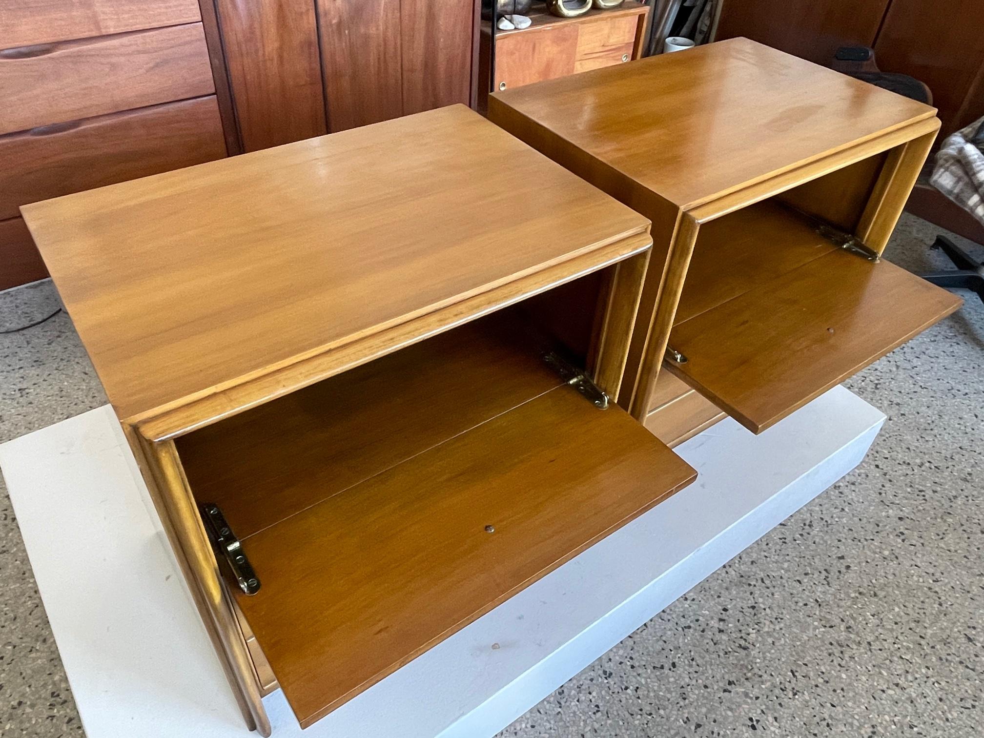 A pair of classic nightstands designed by Paul Frankl for John Stuart, ca' 1950's. Nickeled X handles, drop down fronts with 2 drawers below. Original finish in very good condition.