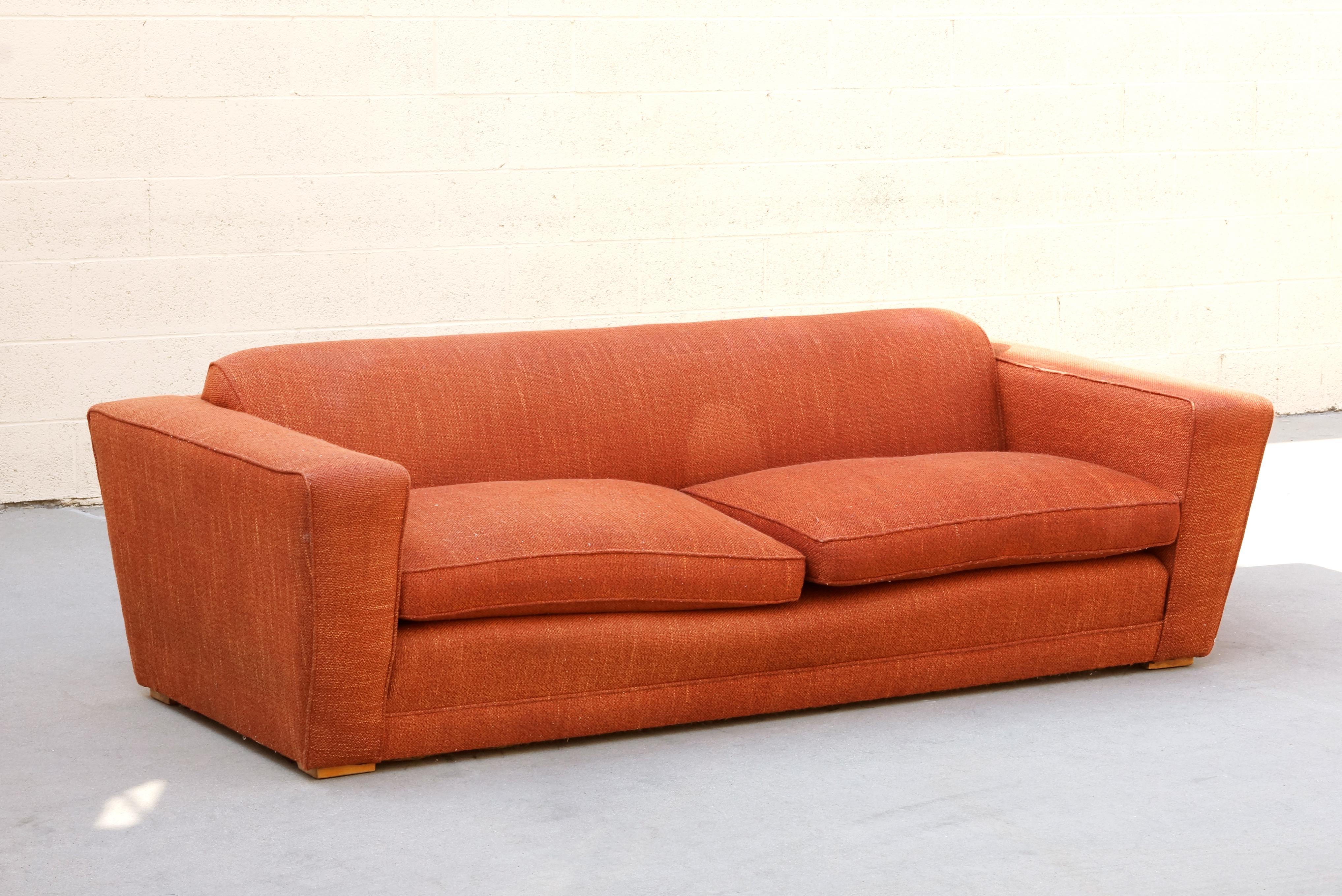 Rare Art Deco club / speed sofa by acclaimed Art Deco designer Paul Frankl. Iconic streamline design. Structurally in very good condition. Original orange tweed upholstery shows wear as pictured. Sold as is. 

Dimensions: 86