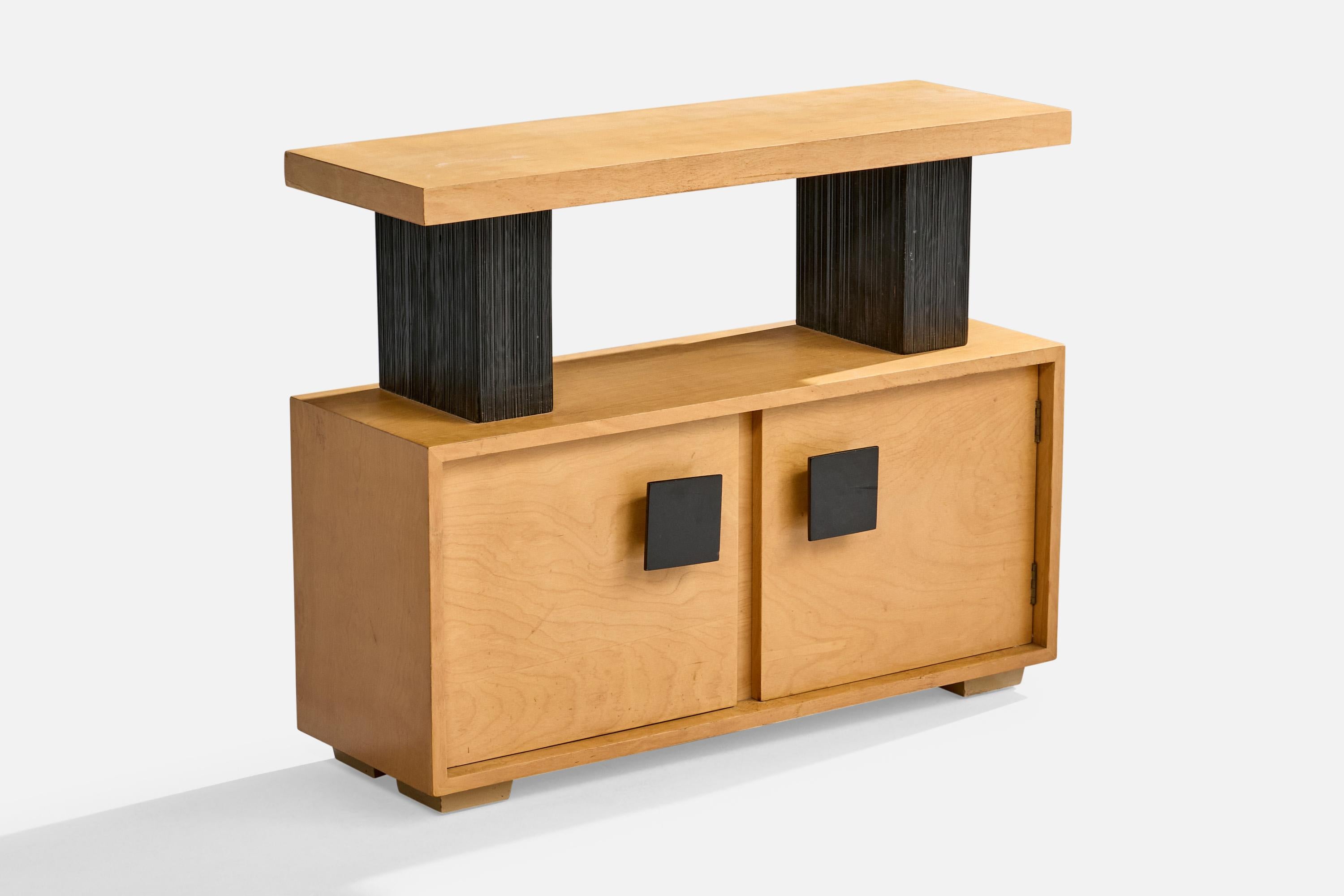 A black-lacquered wood console table with cabinet attributed to Paul Frankl for Barzilay, USA, c. 1950s.

Overall Dimensions (inches): 28.5