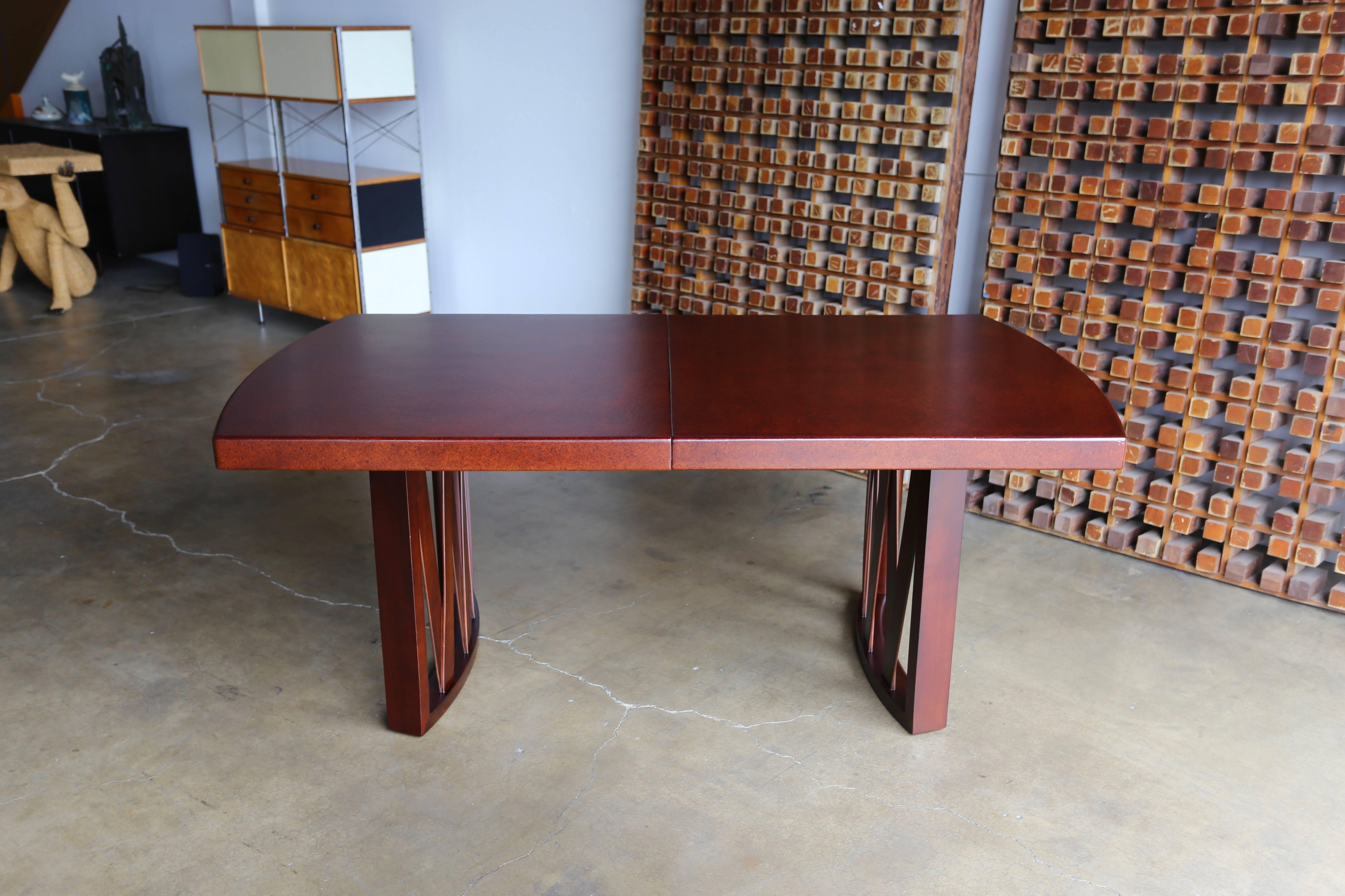 Paul Frankl cork and mahogany dining table for Johnson Furniture Company. This piece has been professionally restored. This table has two leaves that measure 12