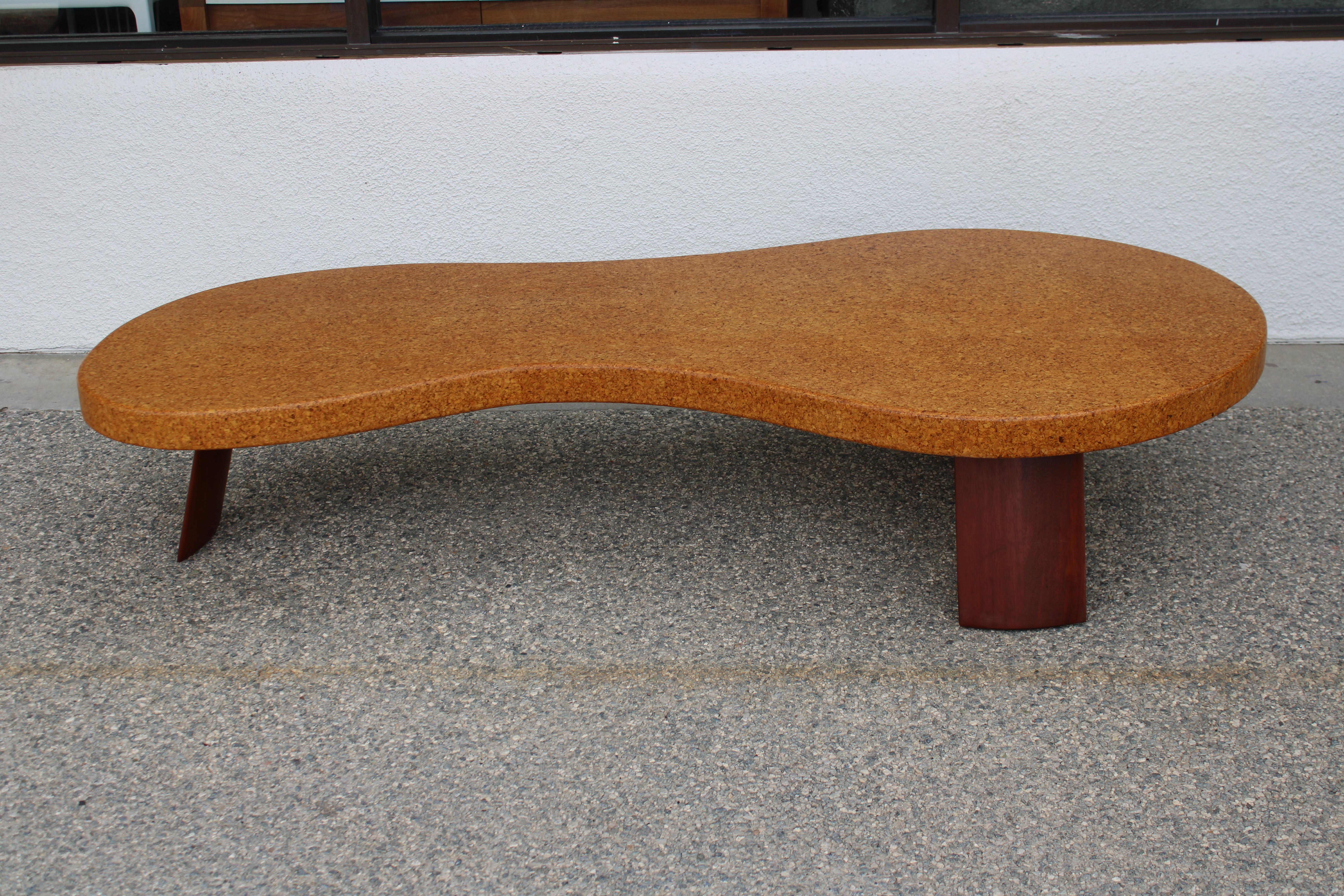 Paul T. Frankl (American/Austrian, 1886-1958) 'Bigfoot' coffee table, model 5028 for the Johnson Furniture Co. Lacquered cork and mahogany. Measuring 72