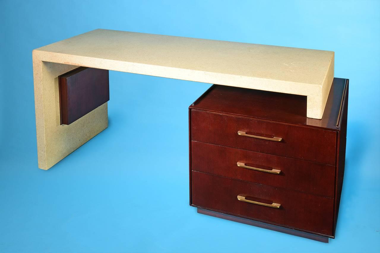 Paul Frankl Desk with large drawers and adjustable cork desk top and mahogany base

USA circa 1950s

Manufactured by Johnson Furniture Company in Grand Rapids Michigan

Mahogany base holds three large drawers with brass hardware 

Adjustable width