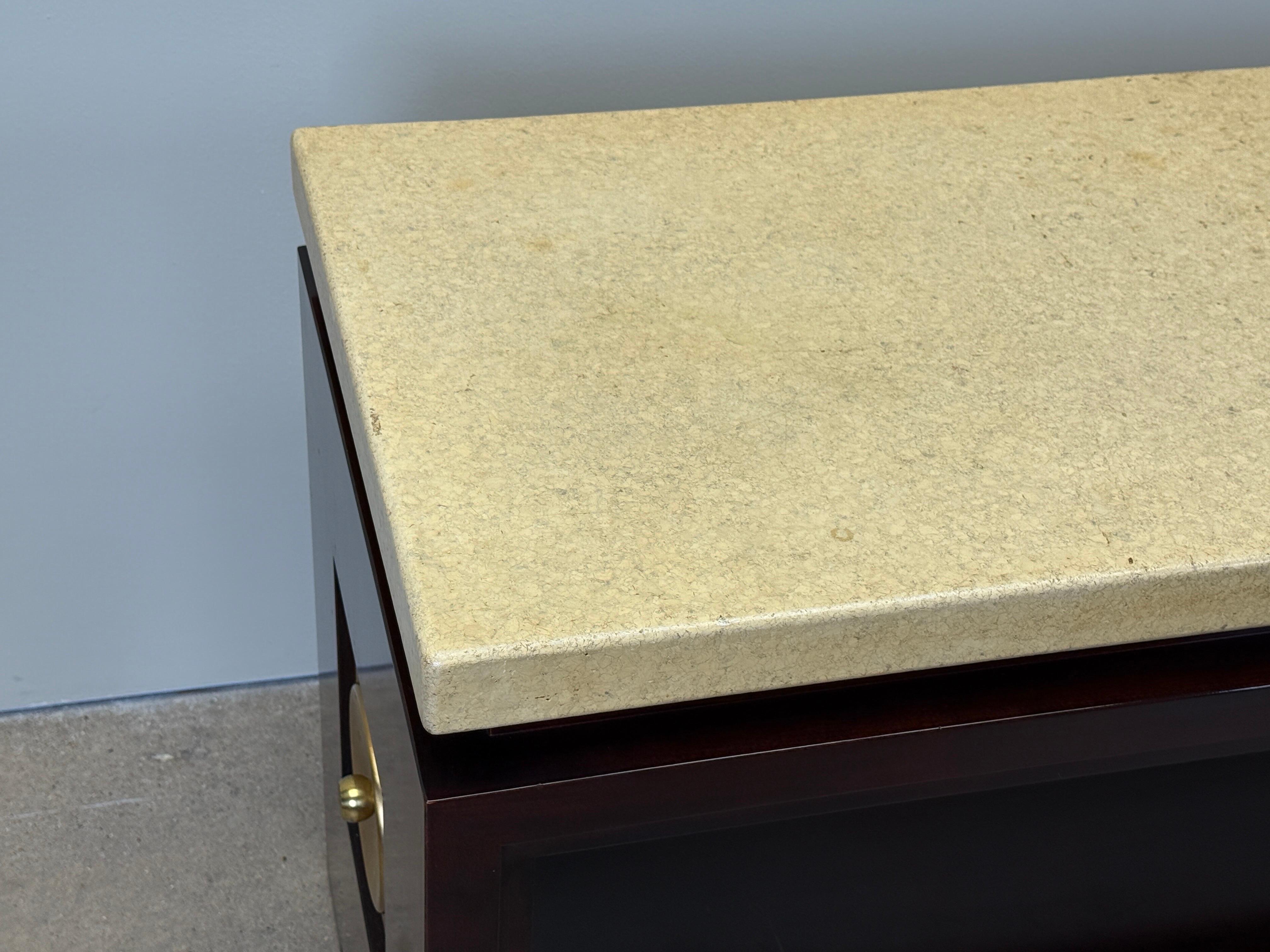 A cork and mahogany console table with brass hardware. Designed by Paul Frankl for Johnson furniture. 