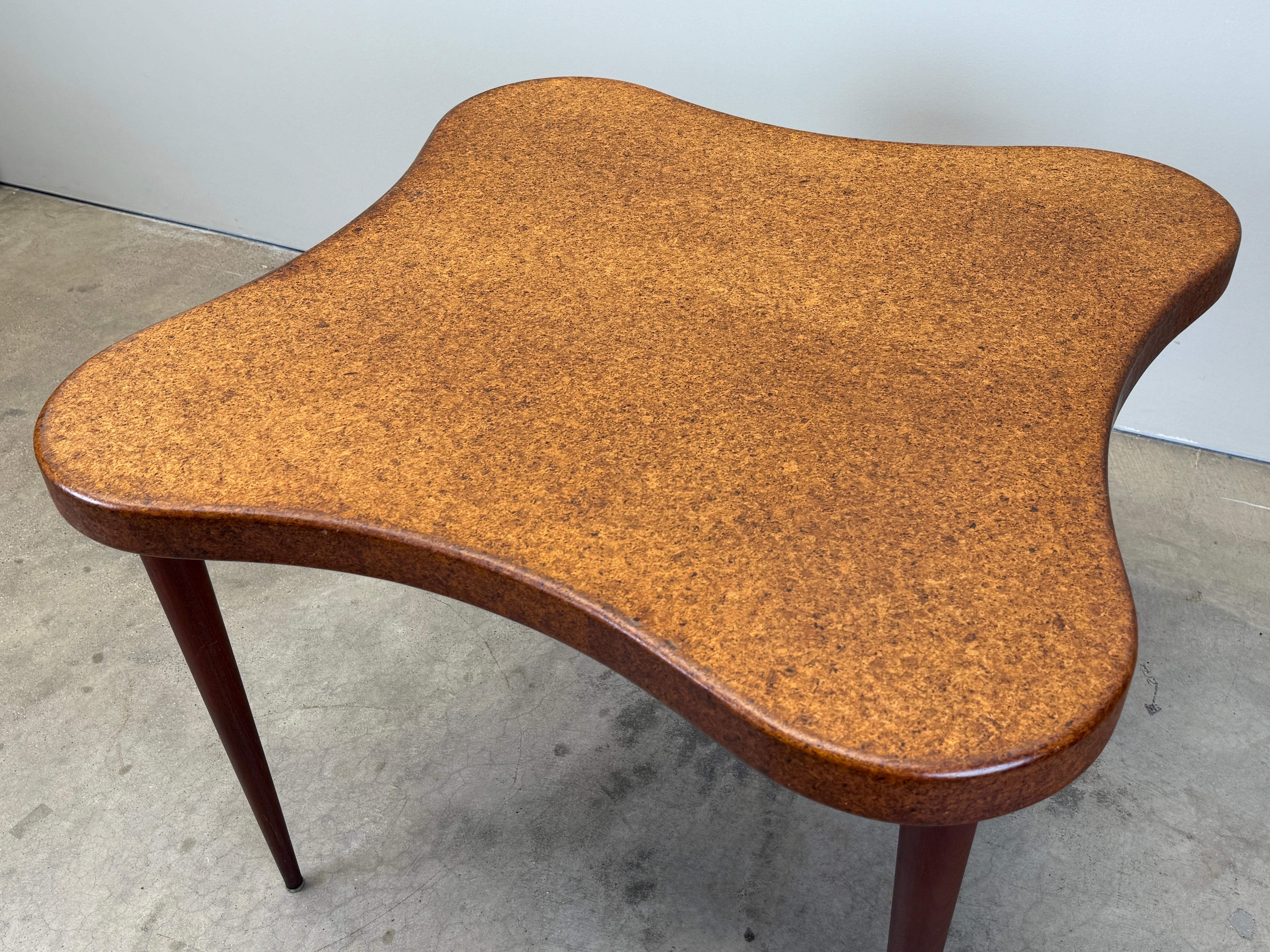 A cork top game table with mahogany legs. Beautiful patina to cork. Designed by Paul Frankl for Johnson furniture. 