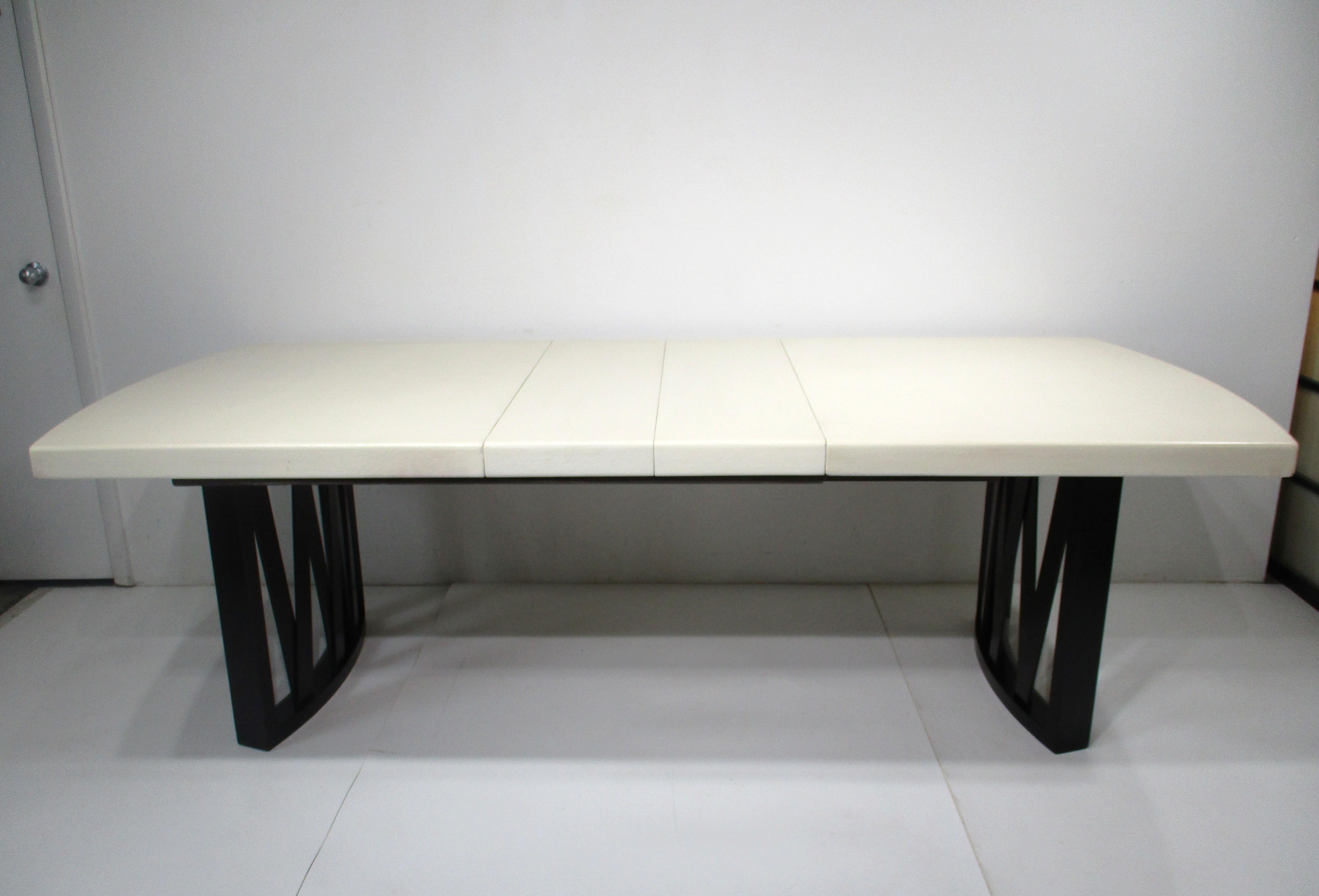 A very well crafted dark ebony toned based dining table with cork top , two 12