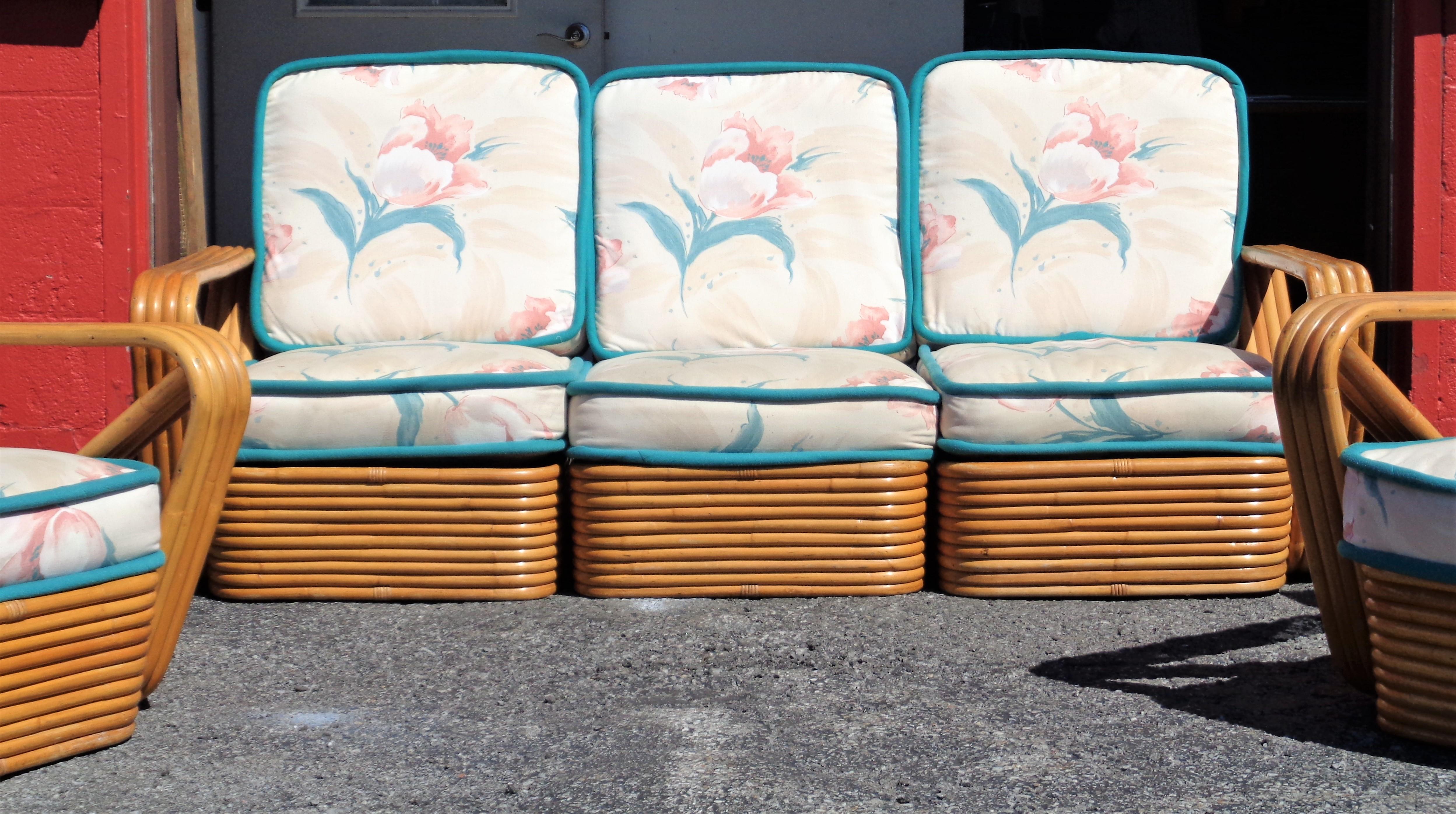 Three piece Paul Frankl design rattan sectional sofa and two matching lounge chairs / armchairs LU961124280982 / coffee table LU961124410932 / bookcase LU961124071482 / pair stacked side tables LU961124294022 in overall good original vintage