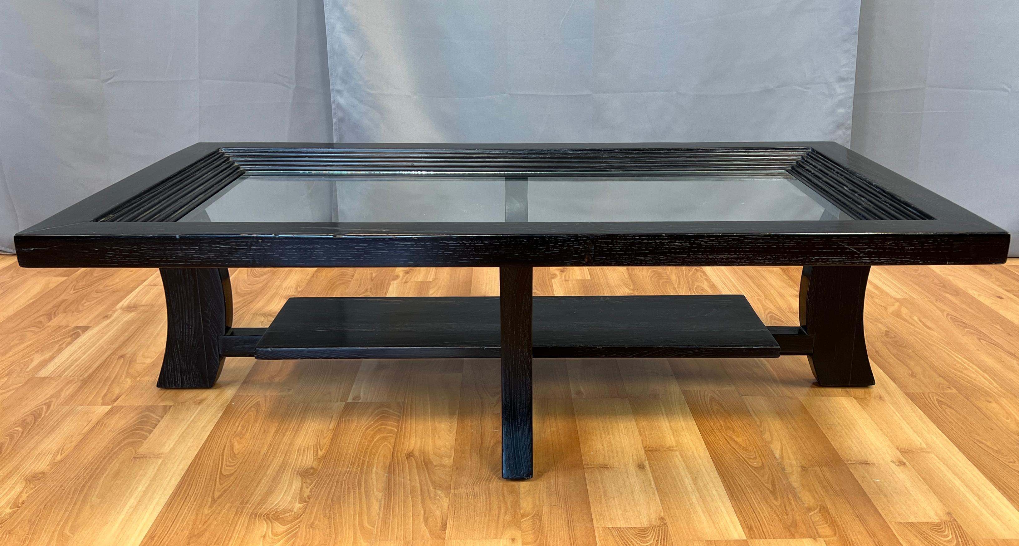 Offered here is a Paul Frankl designed coffee table for Brown Saltman.
Ebonized cerused oak, with glass, table top, and has a step down design, with a shelf below.