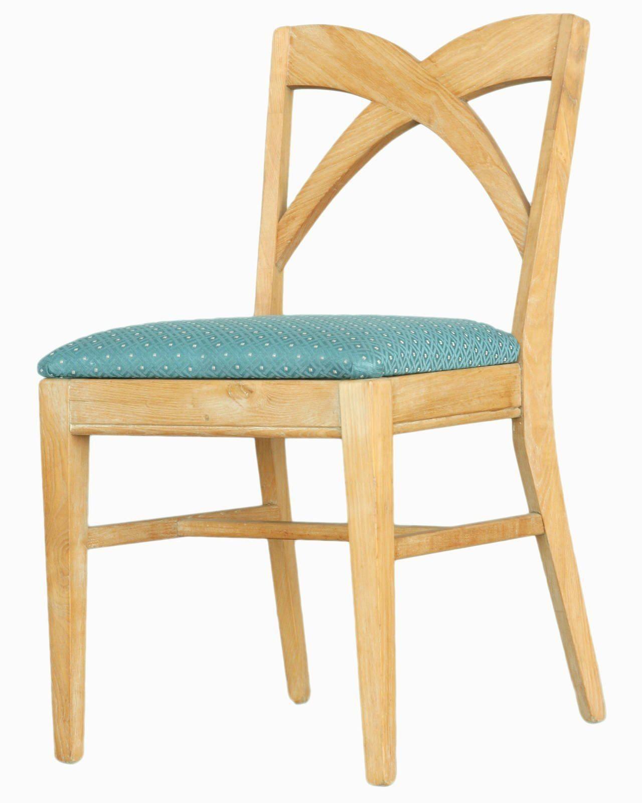 Set of dining chairs by Paul Frankl for the Brown Saltman group. The chairs are upholstered in high quality blue cotton fabric with a unique crisscross 