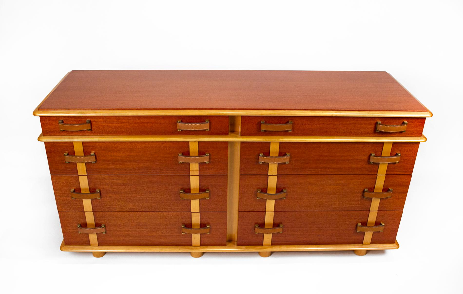 Cabinet constructed of Philippine mahogany and rock maple featuring 8 drawers with original handstitched leather handles attached with solid brass hardware. The interiors of the drawers are oak. This cabinet includes the coordinating solid maple