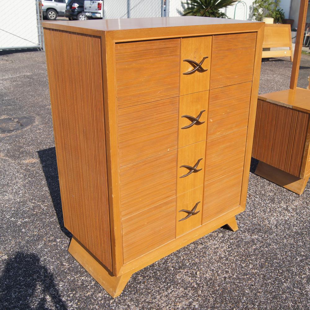 A mid century modern chest of drawers designed by Paul Frankl and made by Brown Saltman.  An oak case with combed oak drawer fronts and signature Frankl X pulls.  As shown in the last image, we have several matching pieces of Paul Frankl bedroom
