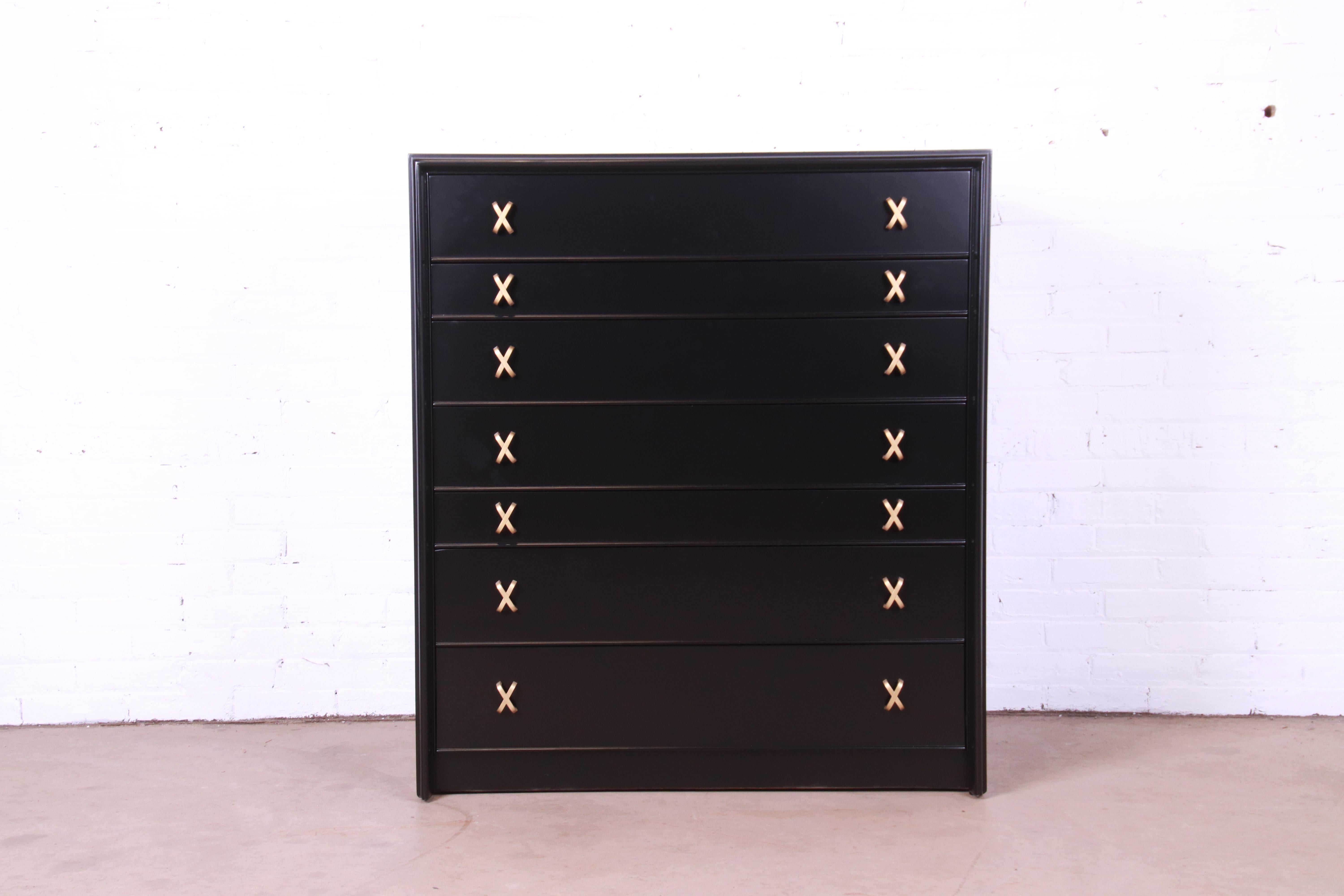 An exceptional Mid-Century Modern black lacquered seven-drawer highboy dresser or chest of drawers

By Paul Frankl for Johnson Furniture and retailed by John Stuart

USA, 1950s

Black lacquered walnut, with iconic brass 