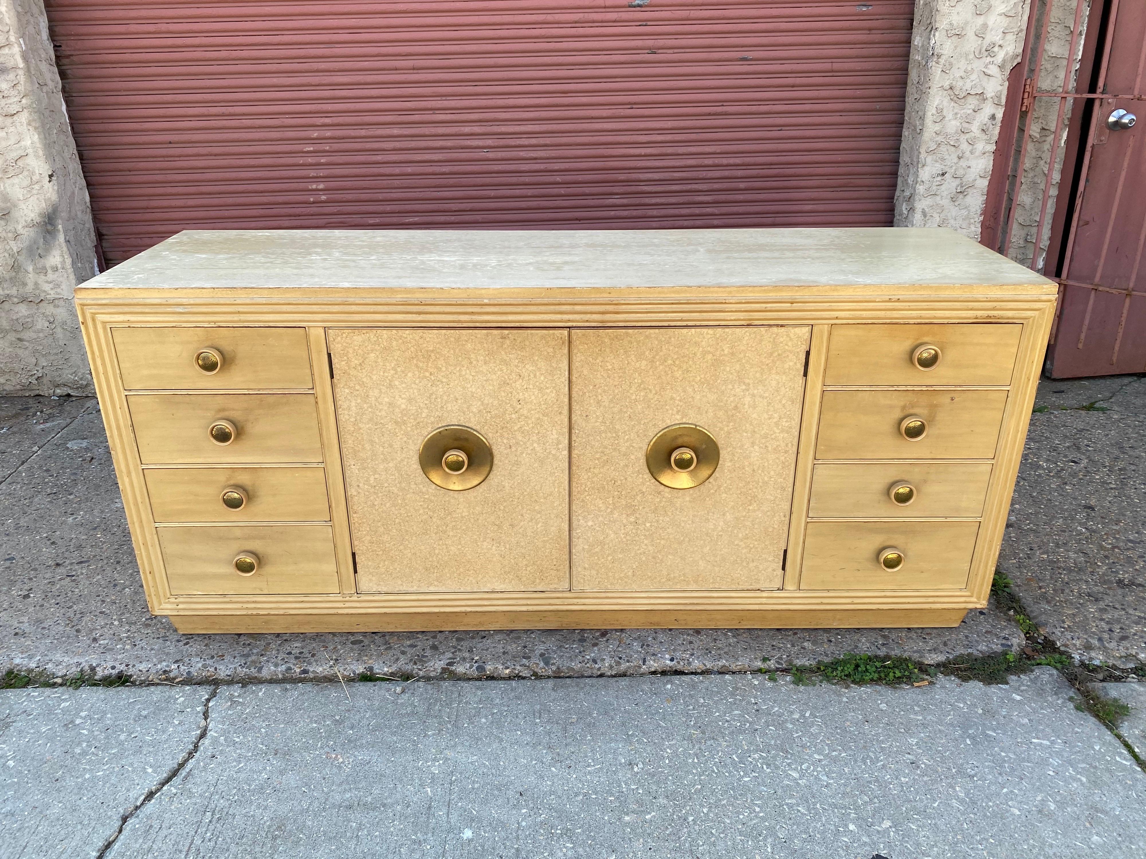 Paul Frankl cork front credenza or buffet. All original! Needs to be refinished, but you can decide how! Loads of storage, doors open to reveal pull out drawers. Use in the dining room, bedroom or anywhere! Very solid and no veneer damage, just