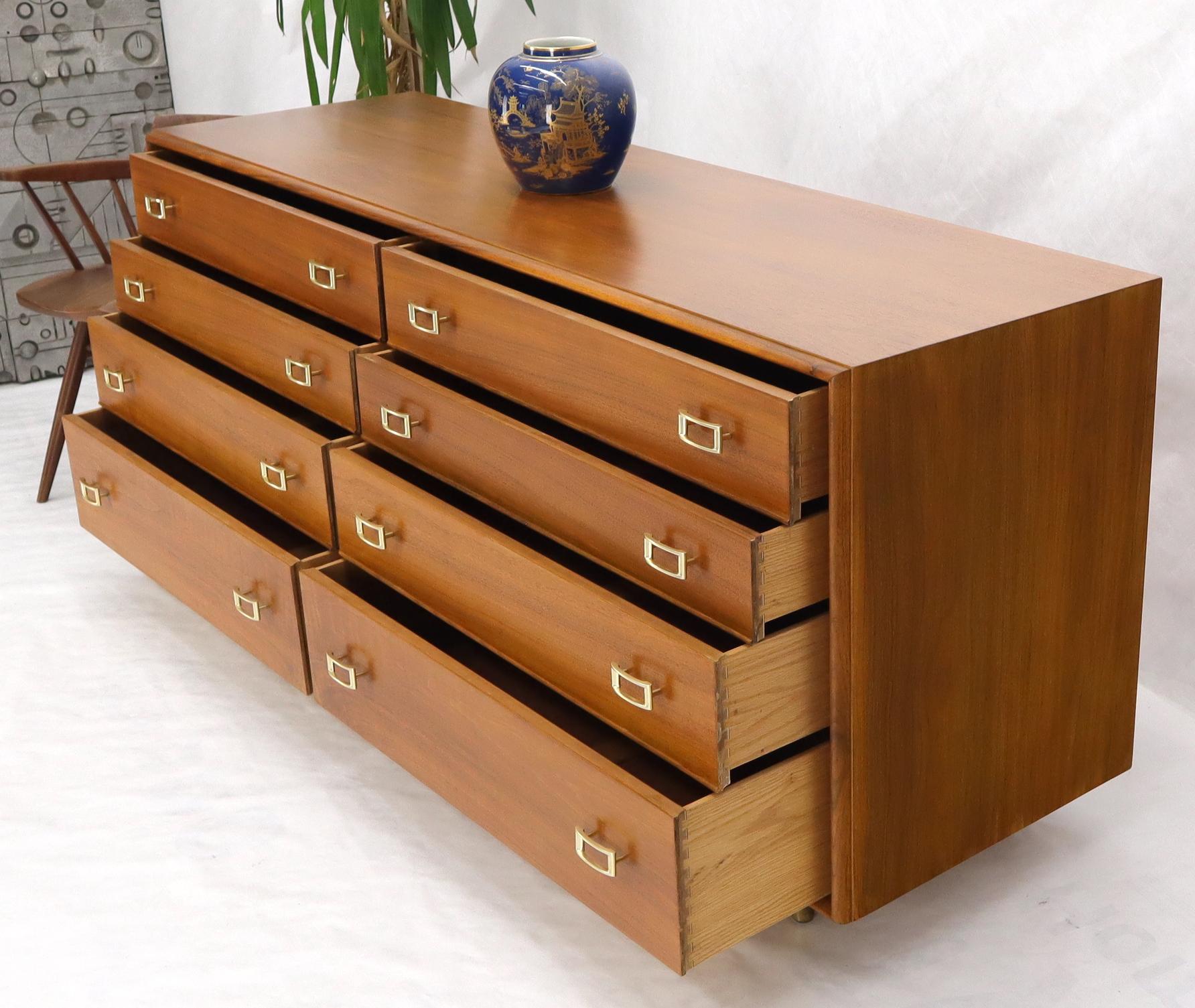 Stunning walnut Mid-Century Modern long dresser by Paul Frankl with solid brass buckle style pulls hardware.
