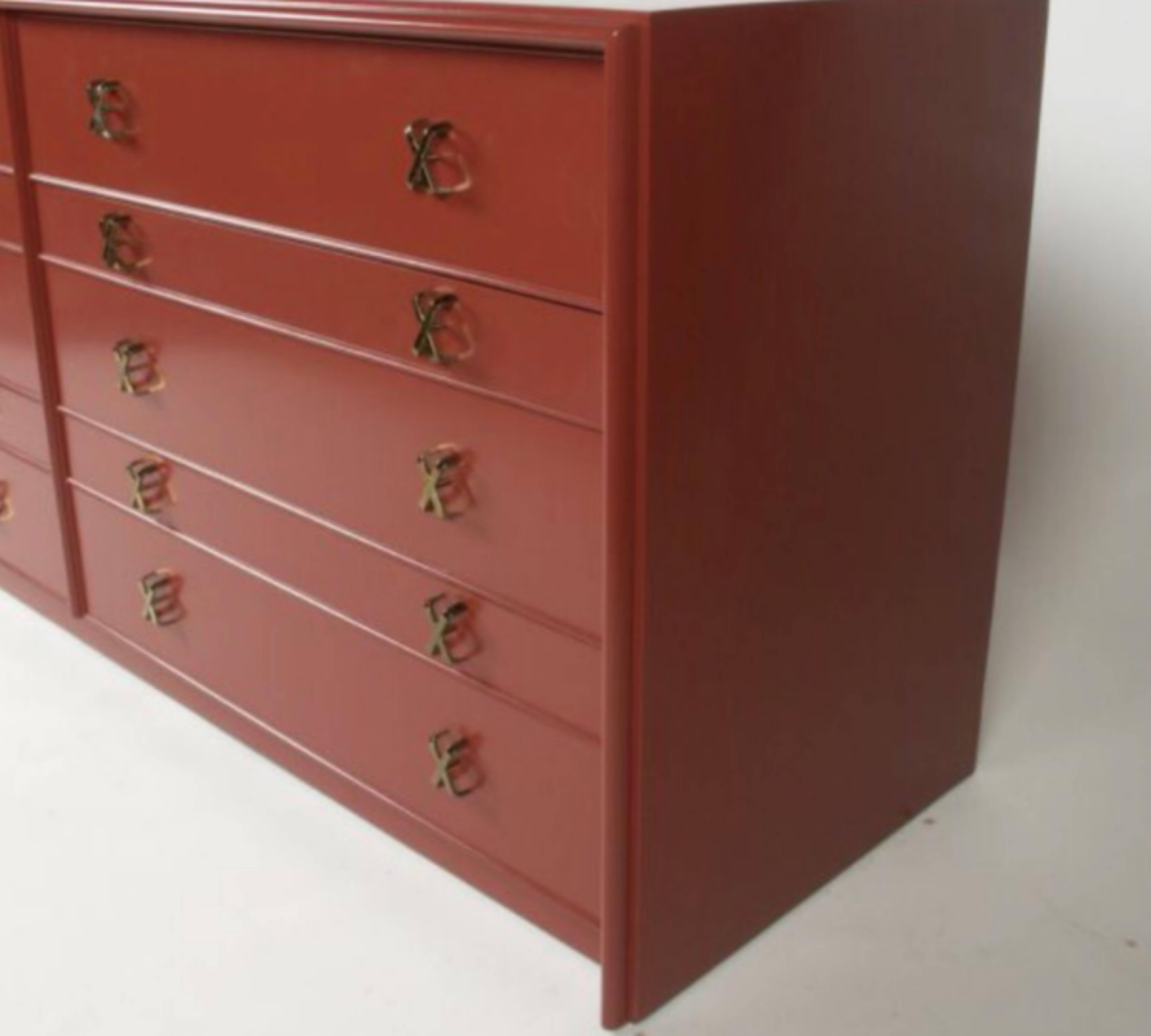 Paul Frankl for Johnson Furniture Co. Mid-Century Modern ten drawers double dresser with brass X-pulls. Shown in Chinese red lacquer (customized lacquer color available or wood stain available). Currently in original ebony finish. 

Currently