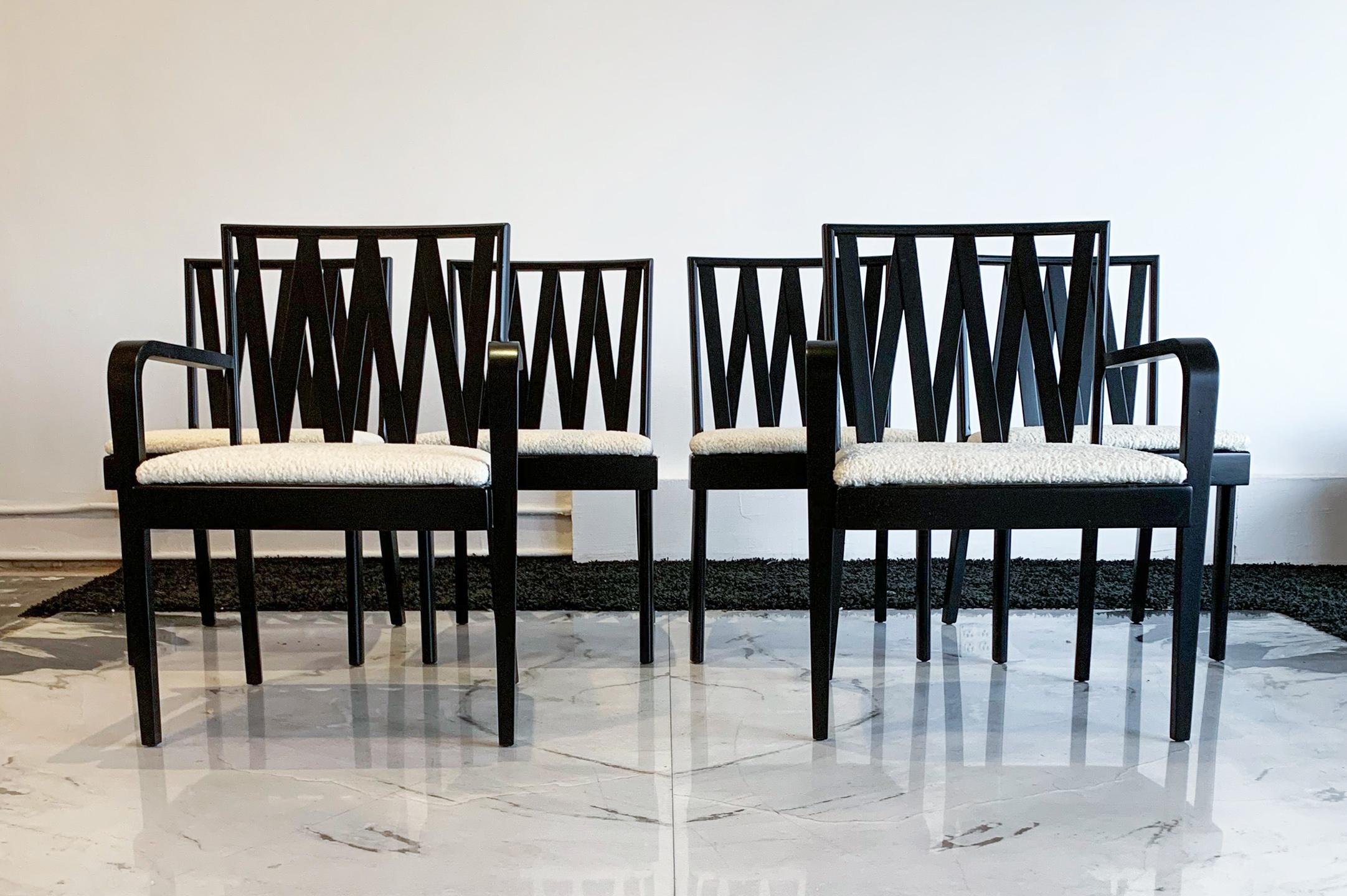 These dining chairs are absolutely stunning! Professionally restored, these chairs were designed by Paul Frankl for Johnson Furniture, distributed by John Stuart and feature an ebonized (black satin) frame and are upholstered in a sumptuous white