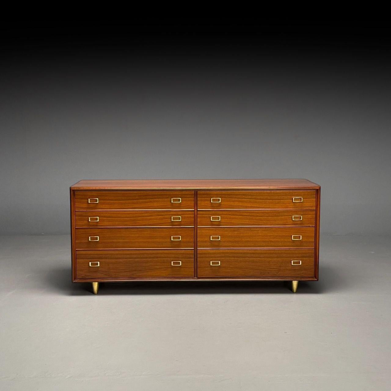Paul Frankl, John Stuart, Mid-Century Modern, Dresser, Walnut, Brass, USA, 1950s

This fully refinished dresser designed by Paul Frankl for John Stuart is a stunning piece. It features a total of eight drawers—four of graduated heights—each adorned