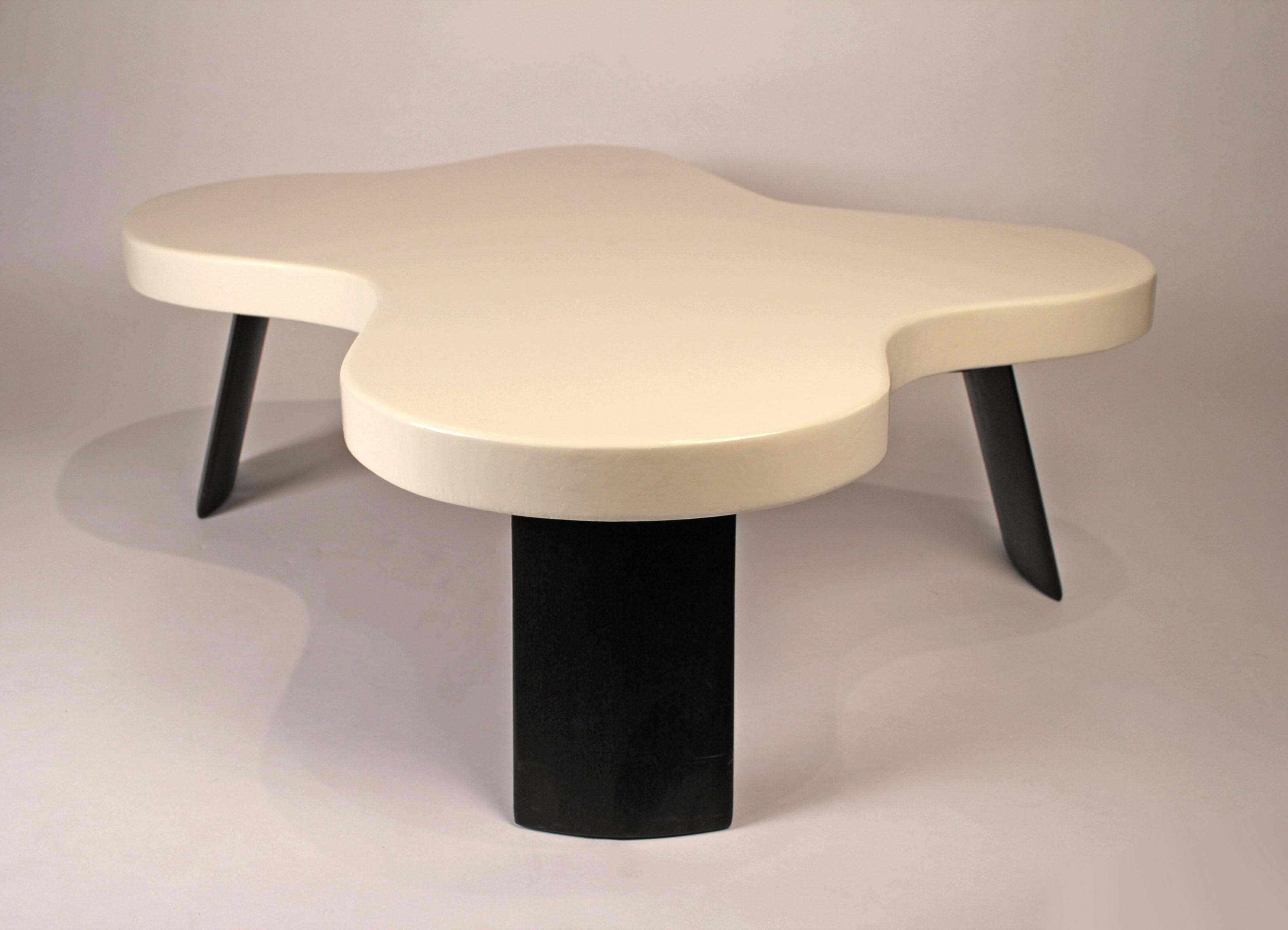 One of Frankl’s most successful and iconic table designs. The Amoeba cocktail table is comprised of a lacquered cork top with stained mahogany legs and was produced by the Johnson Furniture company in the 1950s. Signed to underside with stencilled