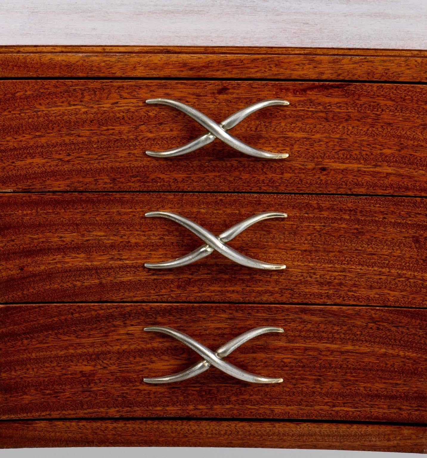 1940s Paul Frankl mahogany sideboard sitting on tall slender legs with cross center pulls.
