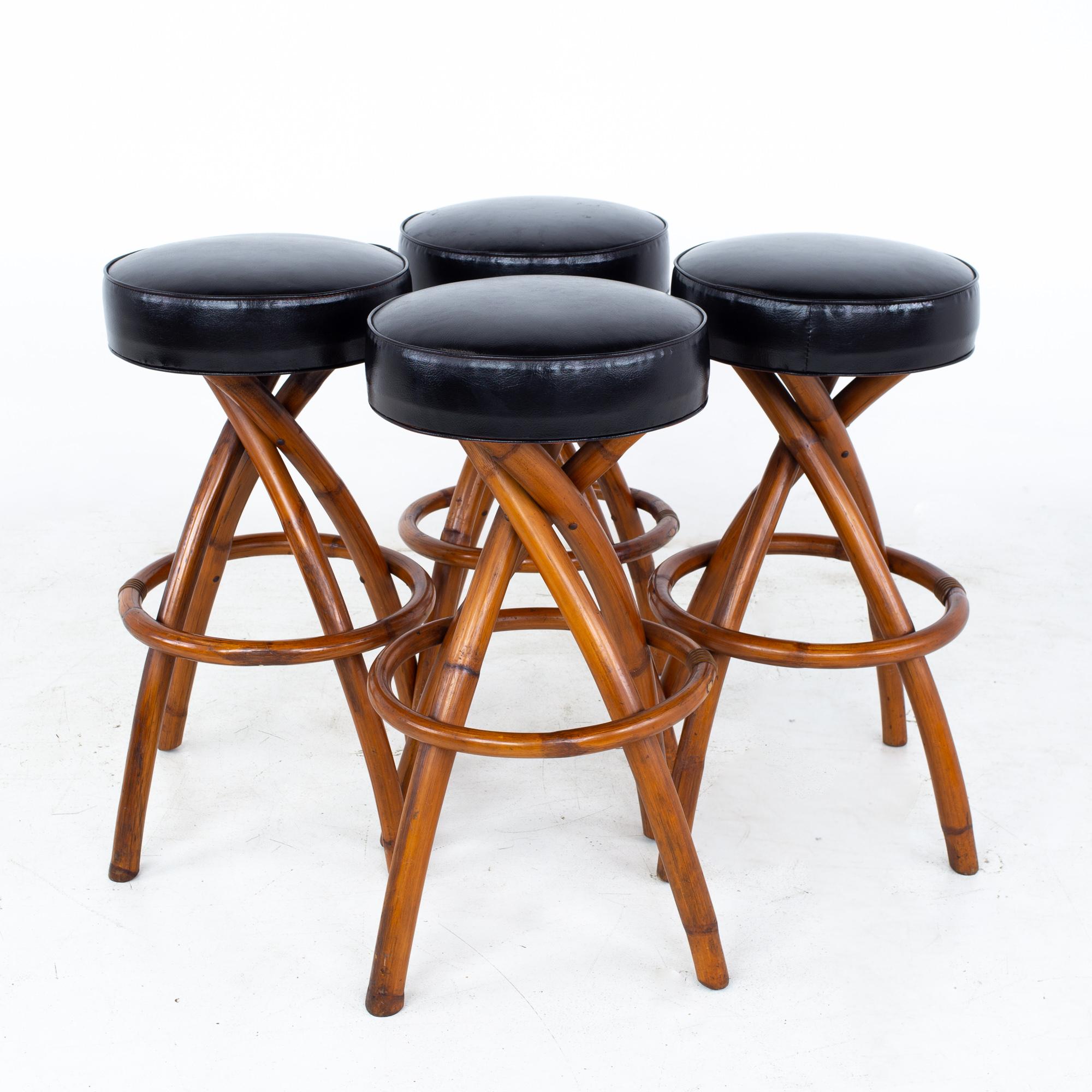 Paul Frankl mid century bamboo swivel bar stools - Set of 4
Each stool measures: 21.5 wide x 21.5 deep x 29.75 inches high, with a seat height/chair clearance of 29.75 inches 

All pieces of furniture can be had in what we call restored vintage
