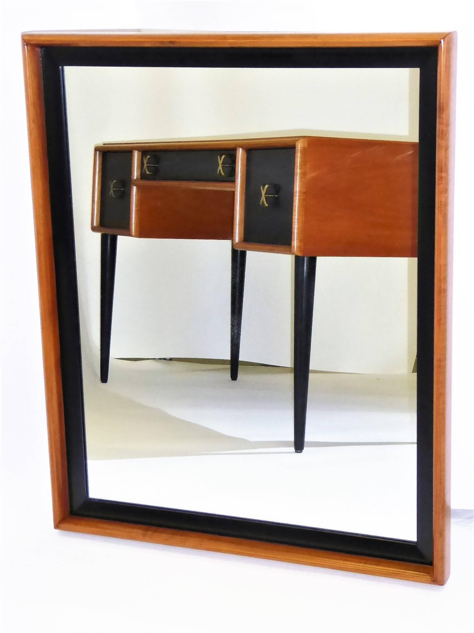 Beautiful Mid-Century Modern creation by master Paul Frankl, a Streamline Moderne mirror, the frame of blond cherry and black lacquer. Made by Johnson Furniture, it was retailed by John Stuart Inc. (See pics). Deftly restored. Wire can be changed to