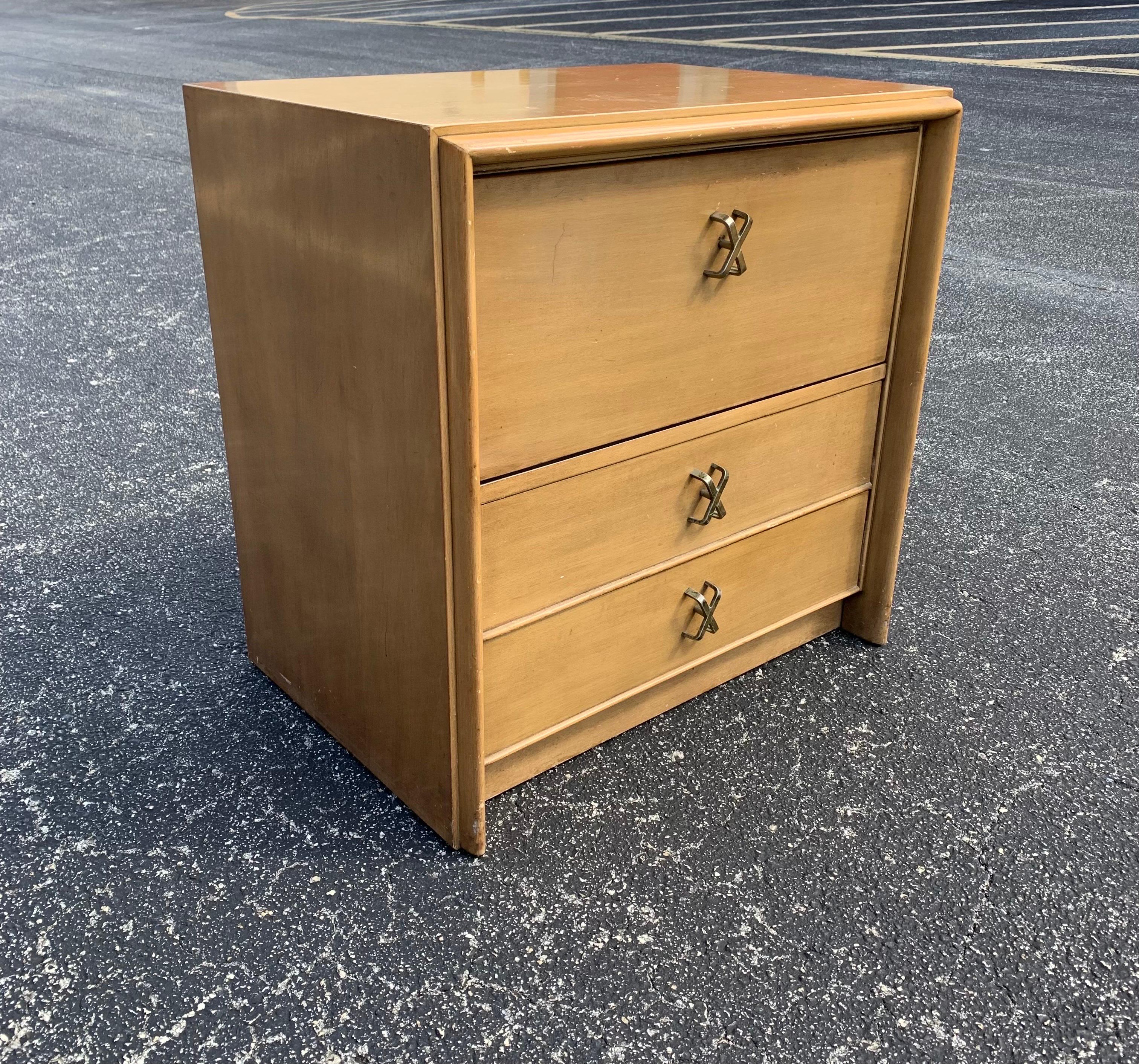 This Paul Frankl nightstand is a true vintage gem, embodying mid-century modern style with its sleek lines and warm brown color. Crafted by Johnson Furniture in America, this original piece is perfect for adding a touch of retro charm to any room.