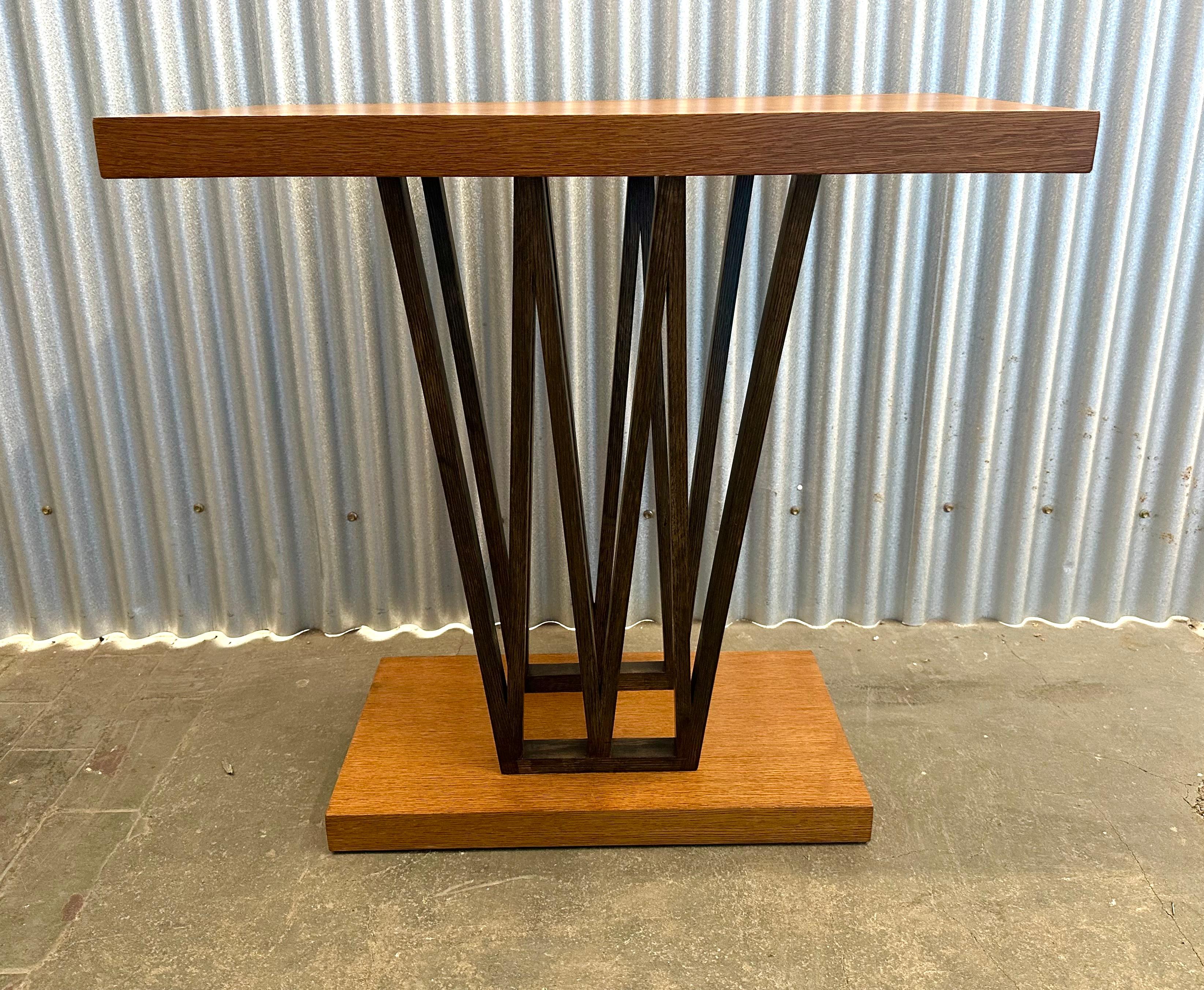 Handsome little table in two-tone bleached and dark stained combed oak. Perfect for an entry way, between a pair of chair, or tucked into a corner.  