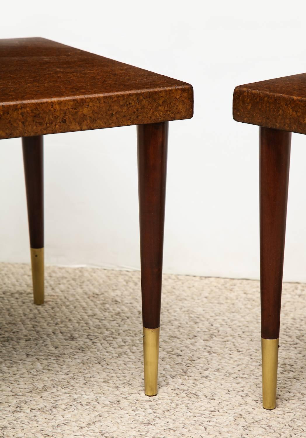 Pair of low side tables by Paul Frankl. Petite side tables, designed for Johnson furniture company. Cork wrapped square tops, mahogany tapered legs and brass feet.