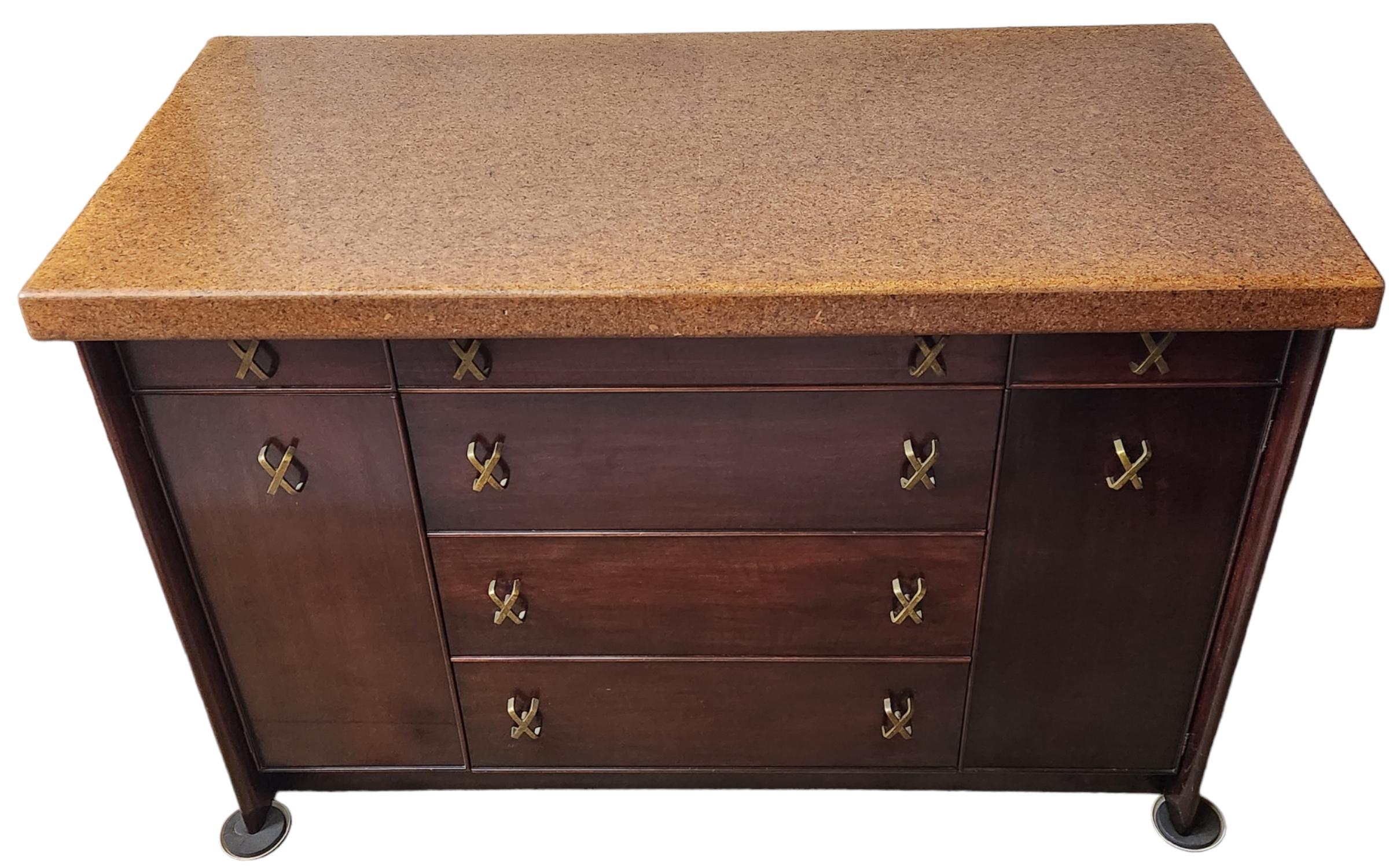 Paul Frankl sideboard with two side doors and six drawers manufactured by Johnson Furniture Company of Grand Rapids, Michigan from the 1950s.
Cork topped cabinet of rosewood stained maple restored in very good condition.


