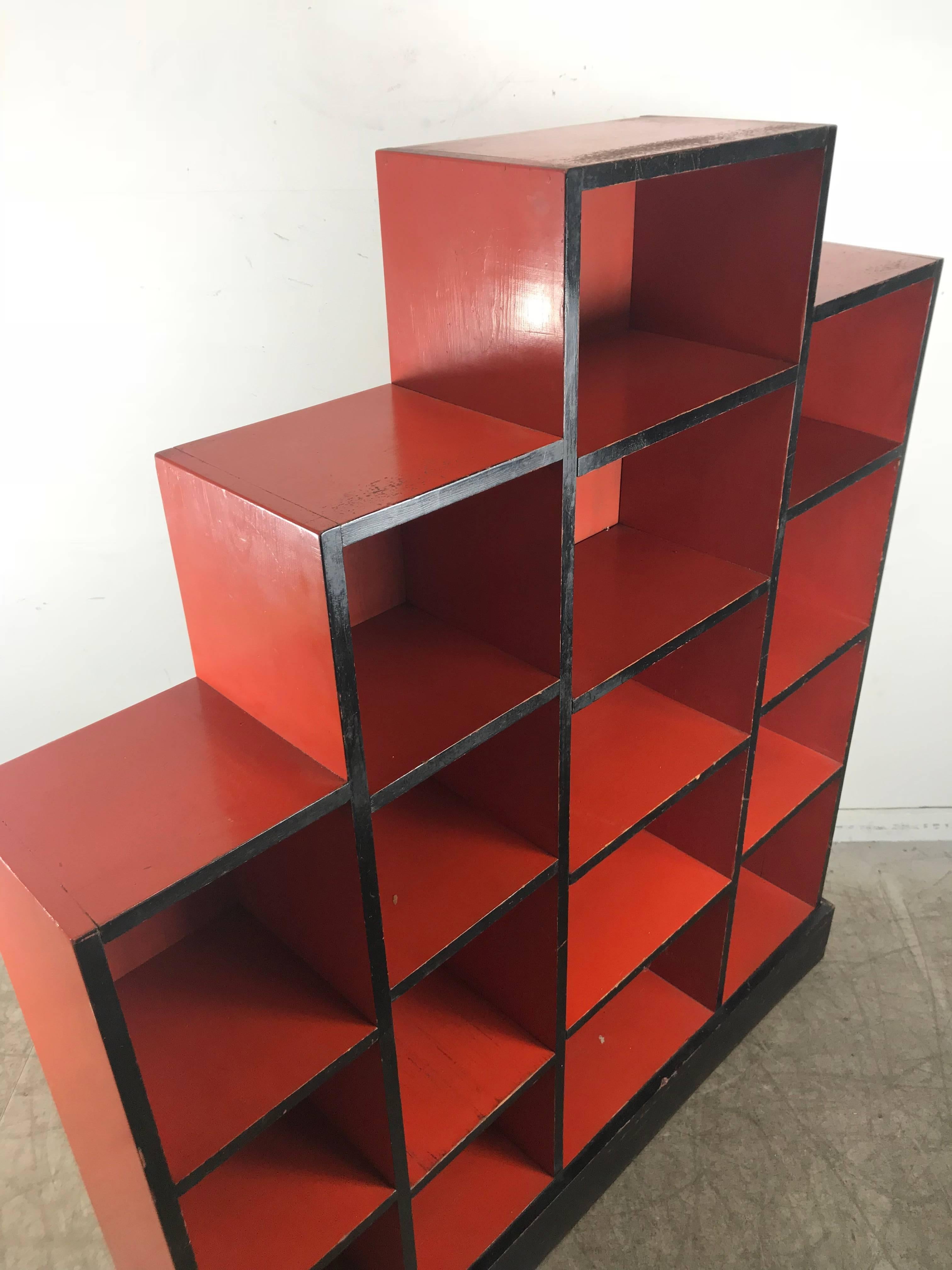 Paul Frankl skyscraper Art Deco bookcase, original red and black lacquer finish, amazing patina, hand delivery avail to New York City or anywhere en route from Buffalo NY.