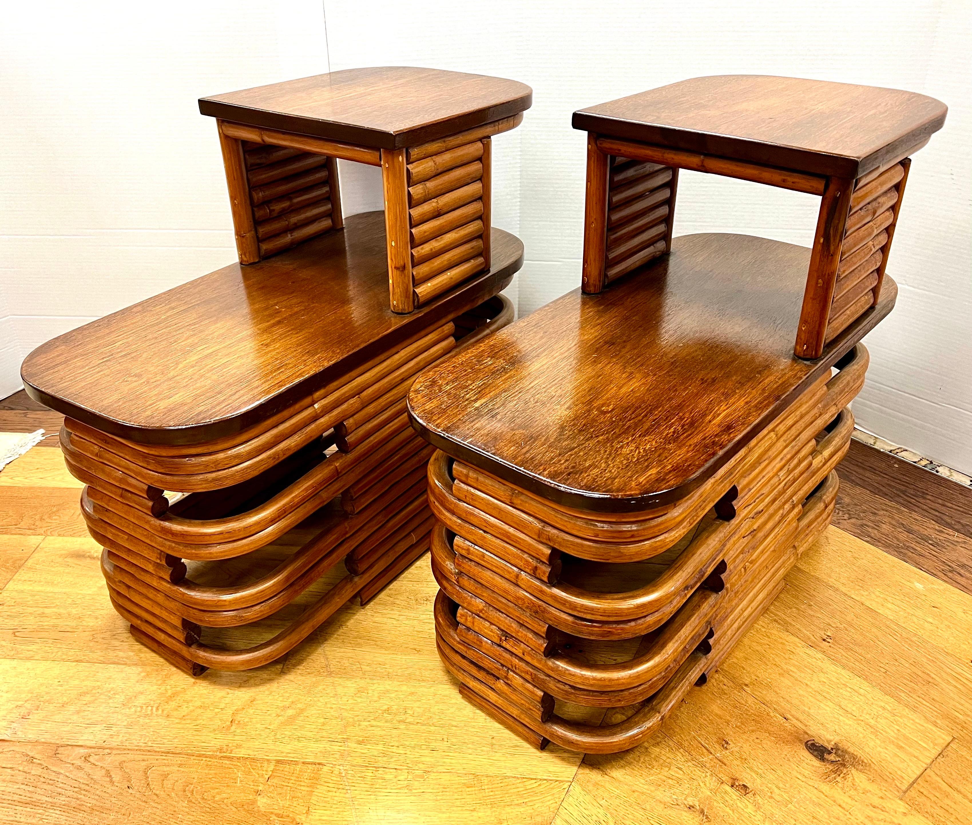 Rare pair of matching Paul Frankl side tables / nightstands, circa early 1940's.
These feature Frankl's coveted two tiered design with mahogany top and stacked bent bamboo frame. Iconic in every way.