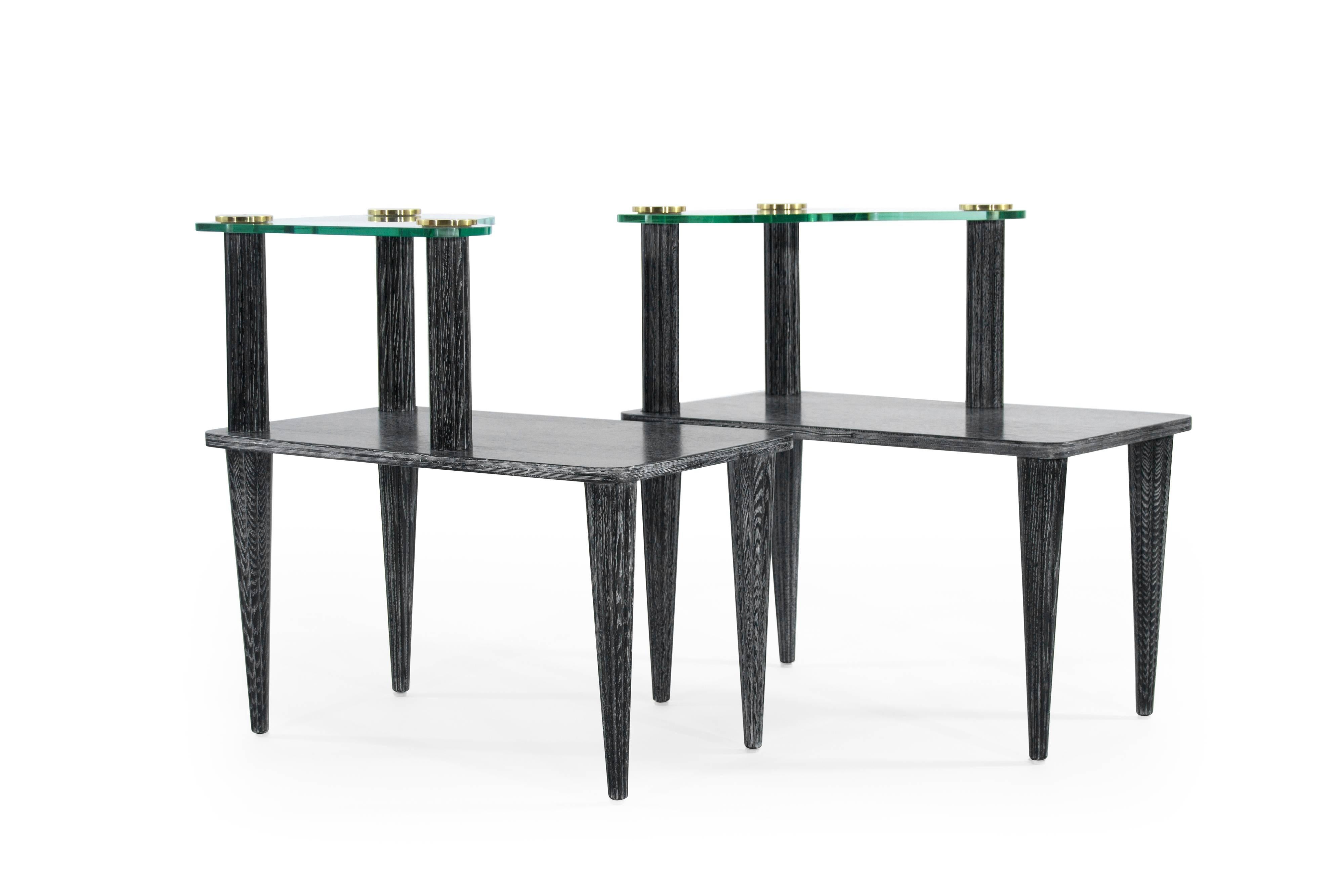 Pair of high profile side tiered end tables in the style of Paul Frankl for Brown Saltman, circa 1950s. Newly redone in black ceruse.