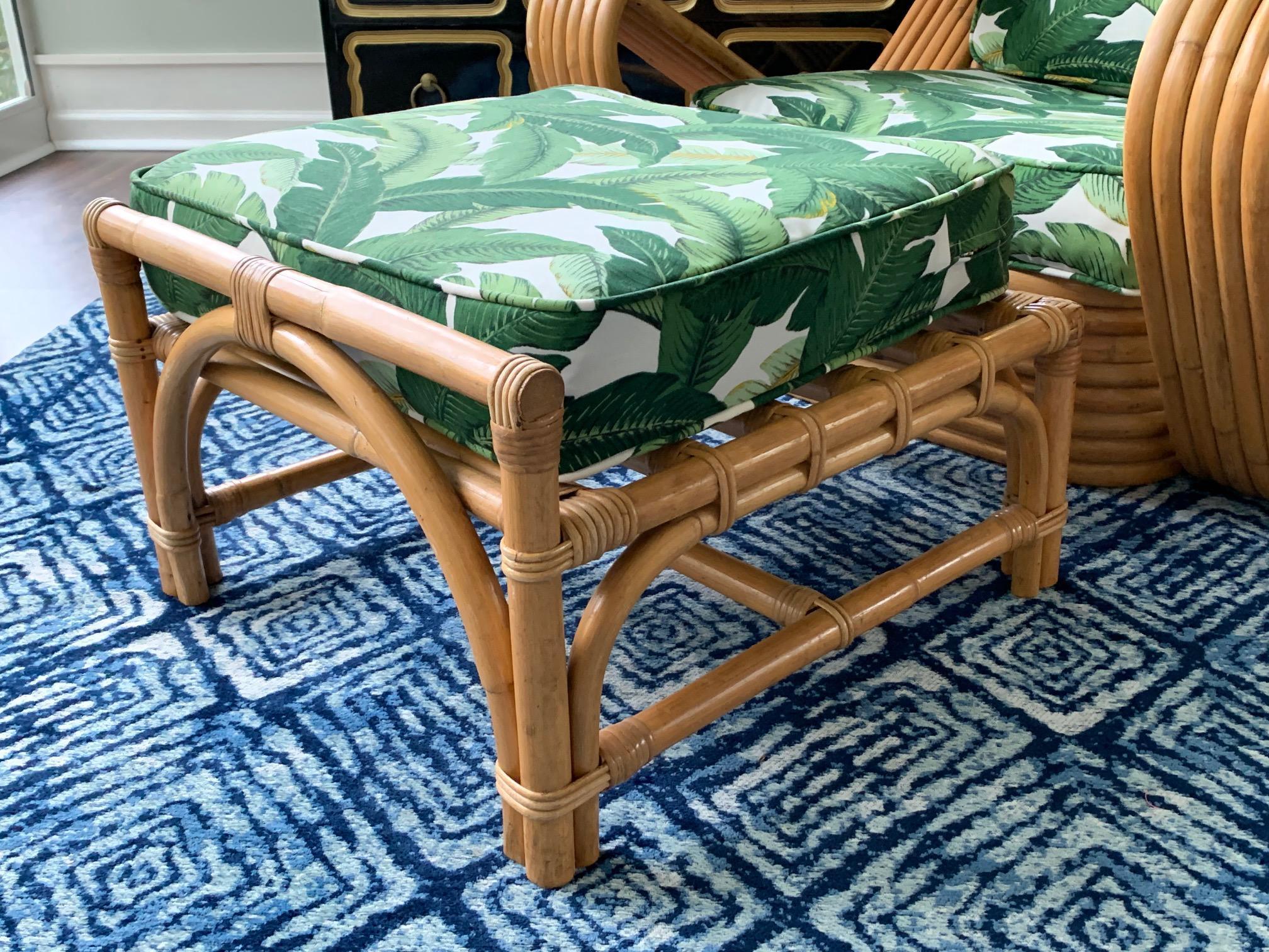 Vintage rattan pretzel lounge chair and ottoman in the manner of Paul Frankl features coveted six strand design and new palm leaf upholstery. Matching ottoman included. Very good condition with very minor imperfections consistent with gentle use.