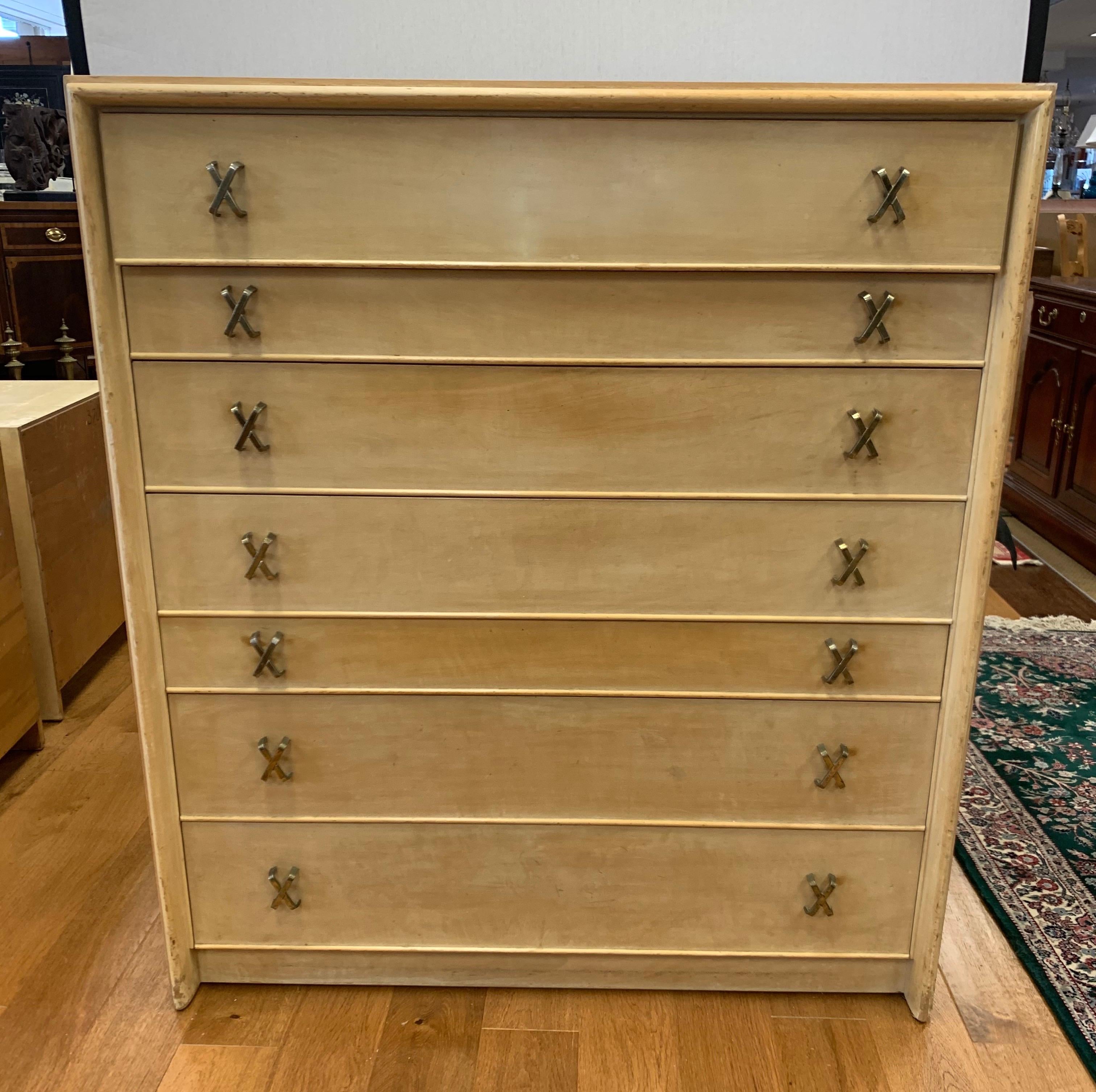 This sophisticated high chest was designed by Paul Frankl for the Johnson Furniture Company, circa late 1940s-early 1950s. The coveted Johnson hallmark is incised inside. The piece, which is one of two we are selling this week, is a prime example of