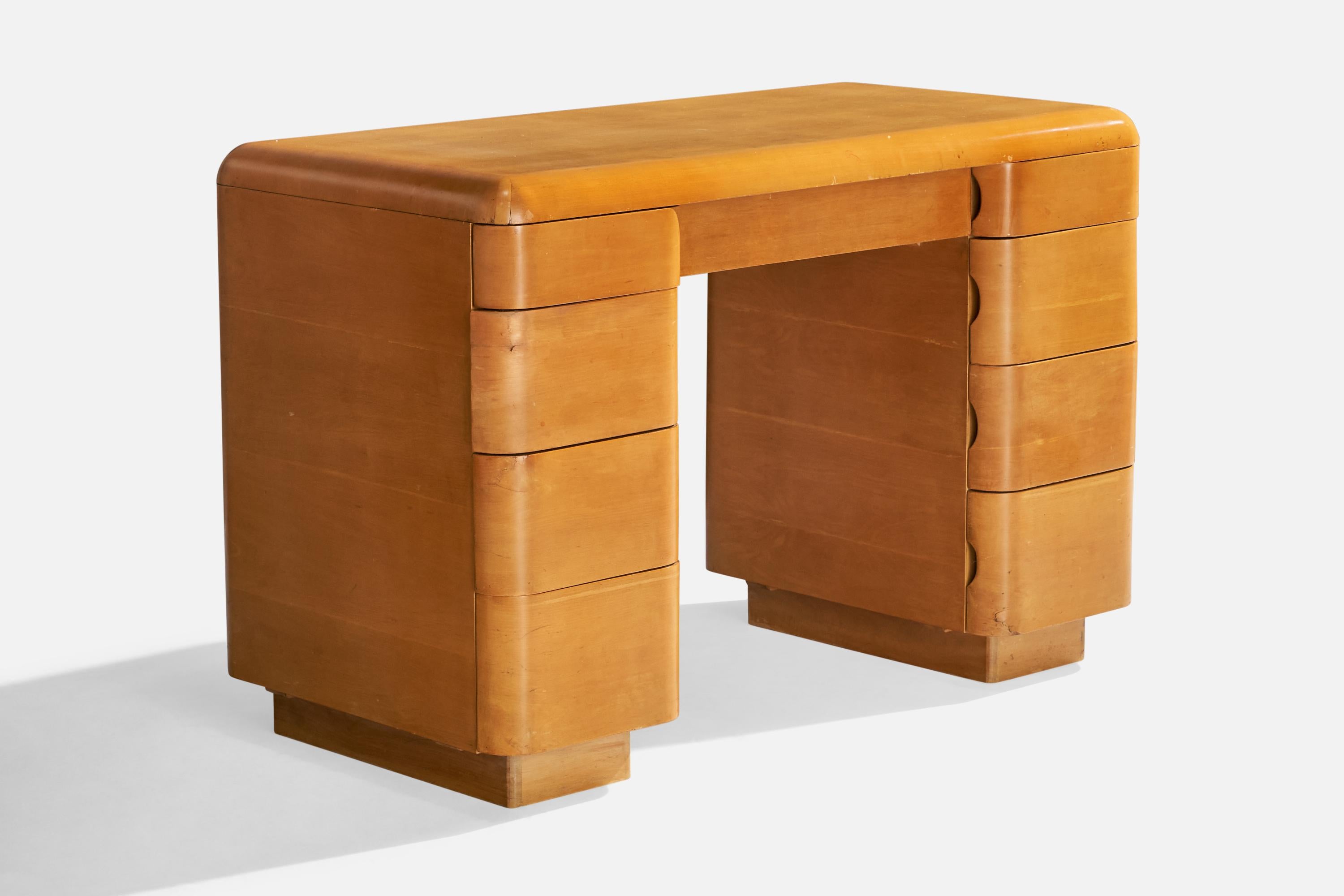 Bureau en bois conçu par Paul Goldman et produit par Plymodern Furniture, États-Unis, vers les années 1940.

Dimensions : 30
