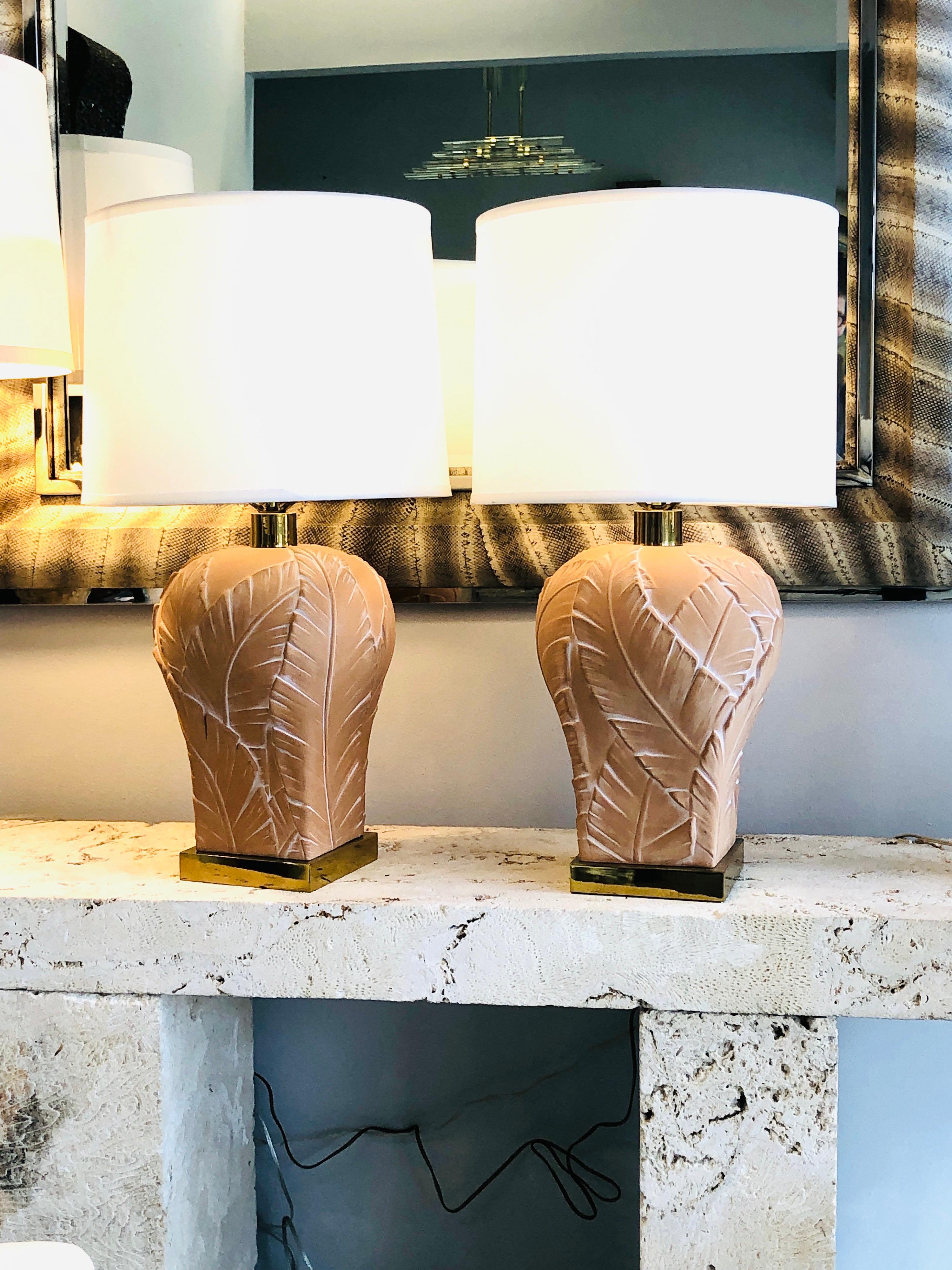 Super chic pair of lamps by Paul Hanson. The large leaves wrap around the whole body. Brass hardware. Diameter of the body is 11