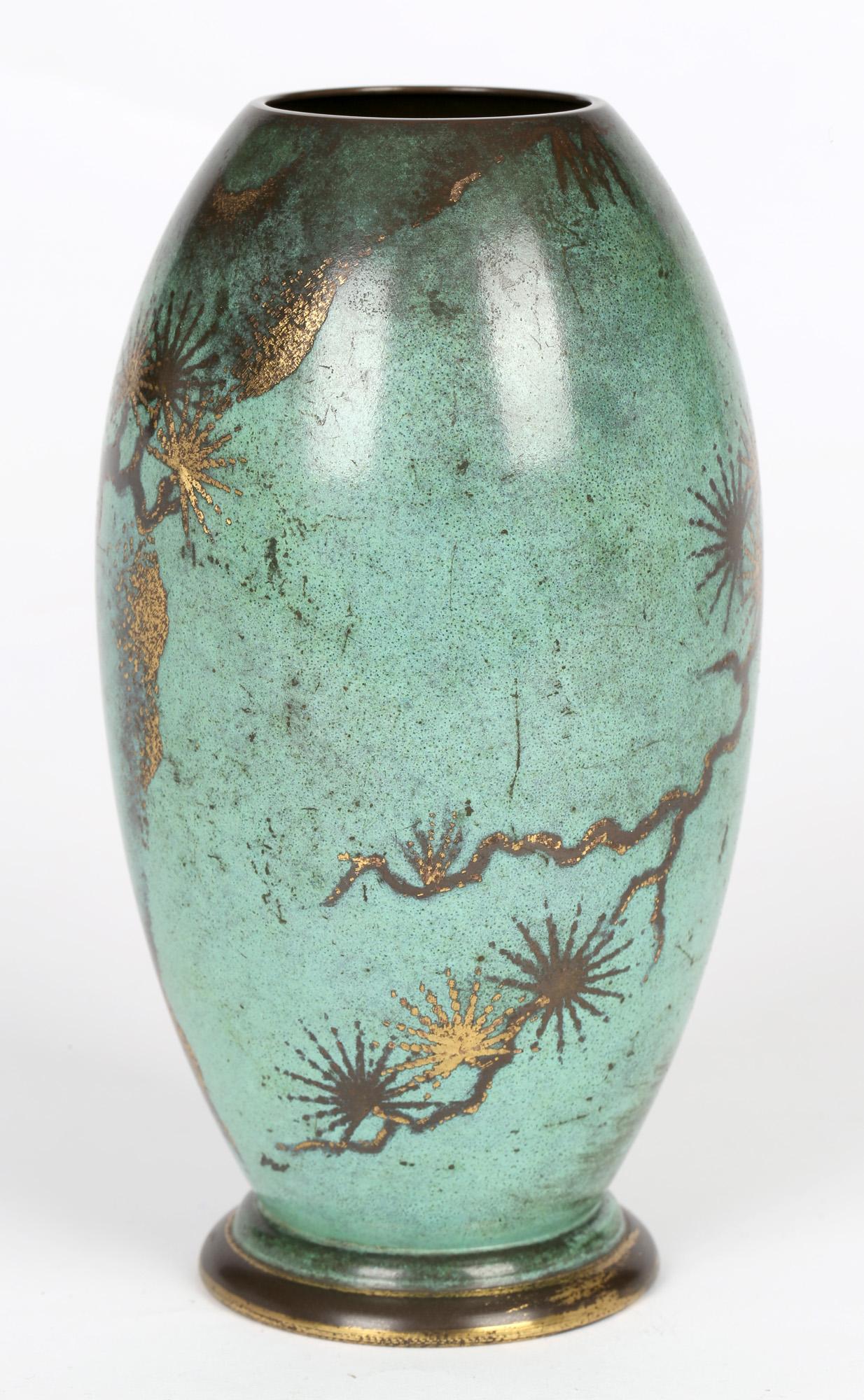 A stunning WMF (Württembergische Metallwarenfabrik) patinated copper Ikora vase decorated with a stylized pine cone design by Paul Haustein (1880-1944) and dating from around 1920. This very finely made vase has a rounded pedestal foot rim with an
