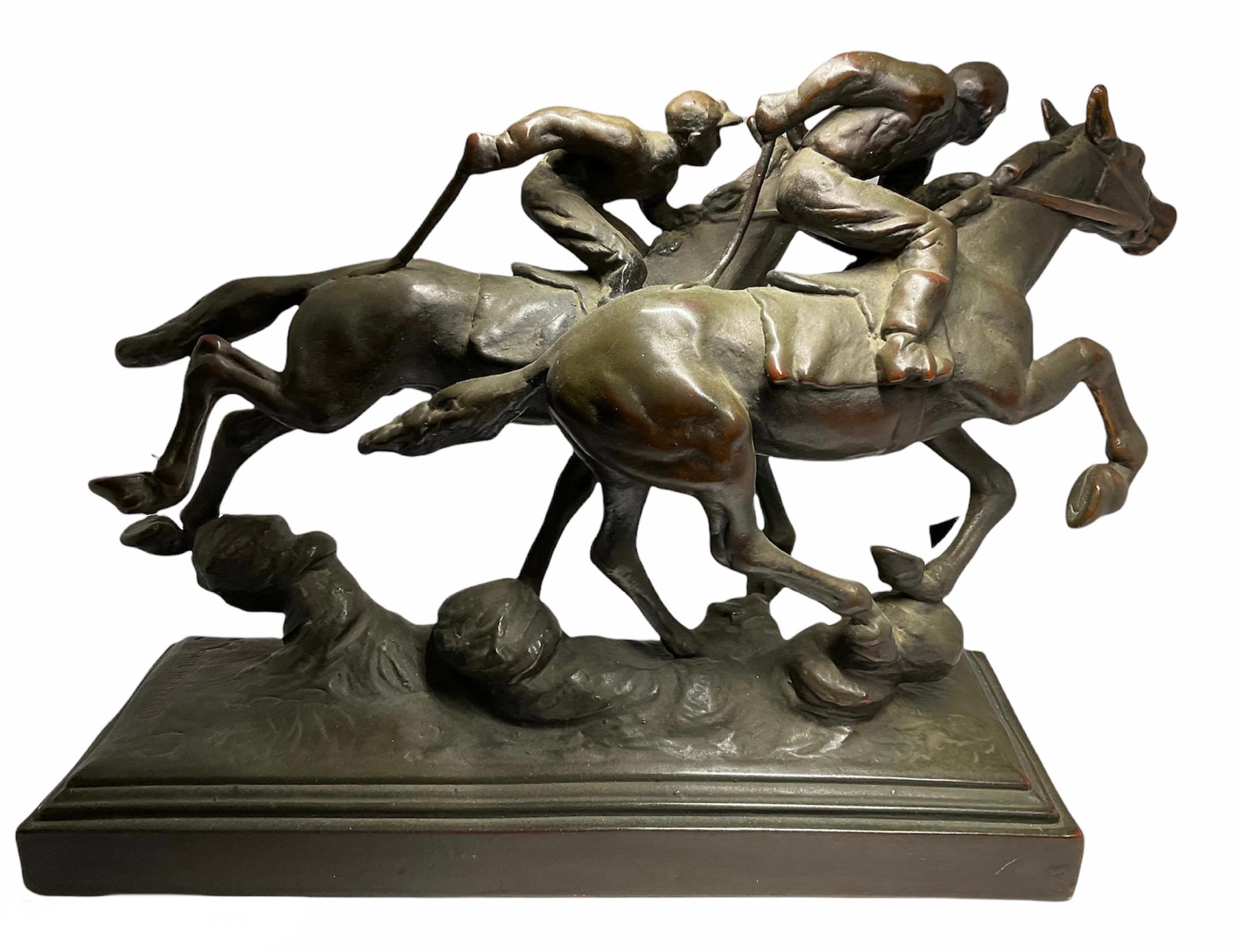 This is a Paul Herzel large patinated bronze sculpture of two “hot -blooded” horses with their jockeys in a competition. The jockeys are wearing their usual outfit while riding the horses. The horses bodies are very closed one to the other and their