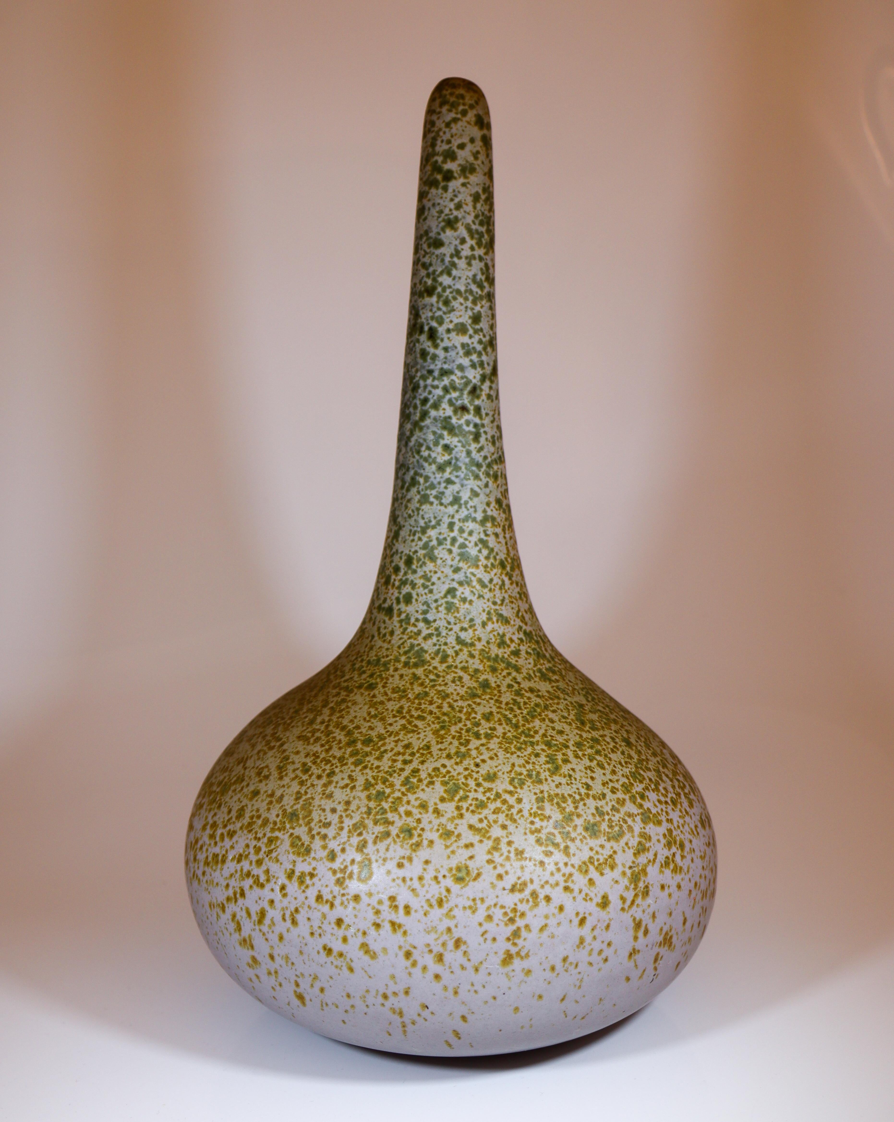 A striking Scandinavian Modern vase designed by Paul Hoff for Gustavsberg, dated 1987. Standing 36 cm tall, this sculptural piece features an elegant elongated neck rising from a broad, rounded base, creating a refined and organic silhouette. The