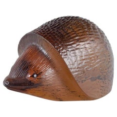 Paul Hoff for Kosta Boda / WMF. Figurine of a hedgehog in warm amber glass.