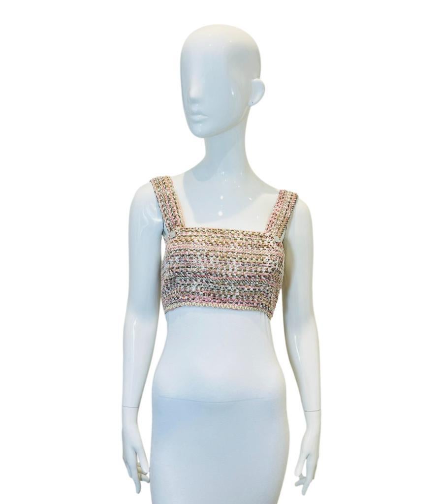 Paul & Joe Tweed Crop Top
Pink sleeveless top designed with white, metallic gold and black threads accent.
Featuring sparkling button embellishment on each side, square neckline to the front and rear.
Size – S (Label missing but